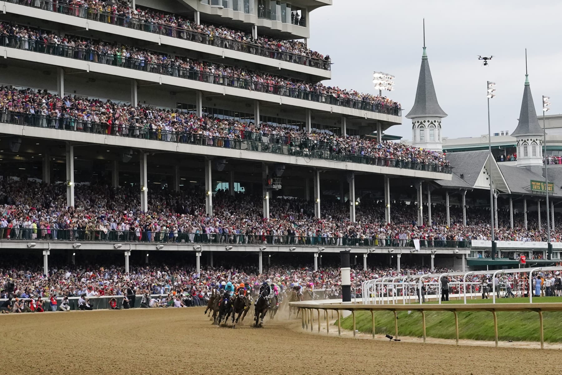 Horses make the first turn as they compete during the 149th running of the Kentucky Derby horse race at Churchill Downs Saturday, May 6, 2023, in Louisville, Ky. (AP Photo/Julio Cortez)