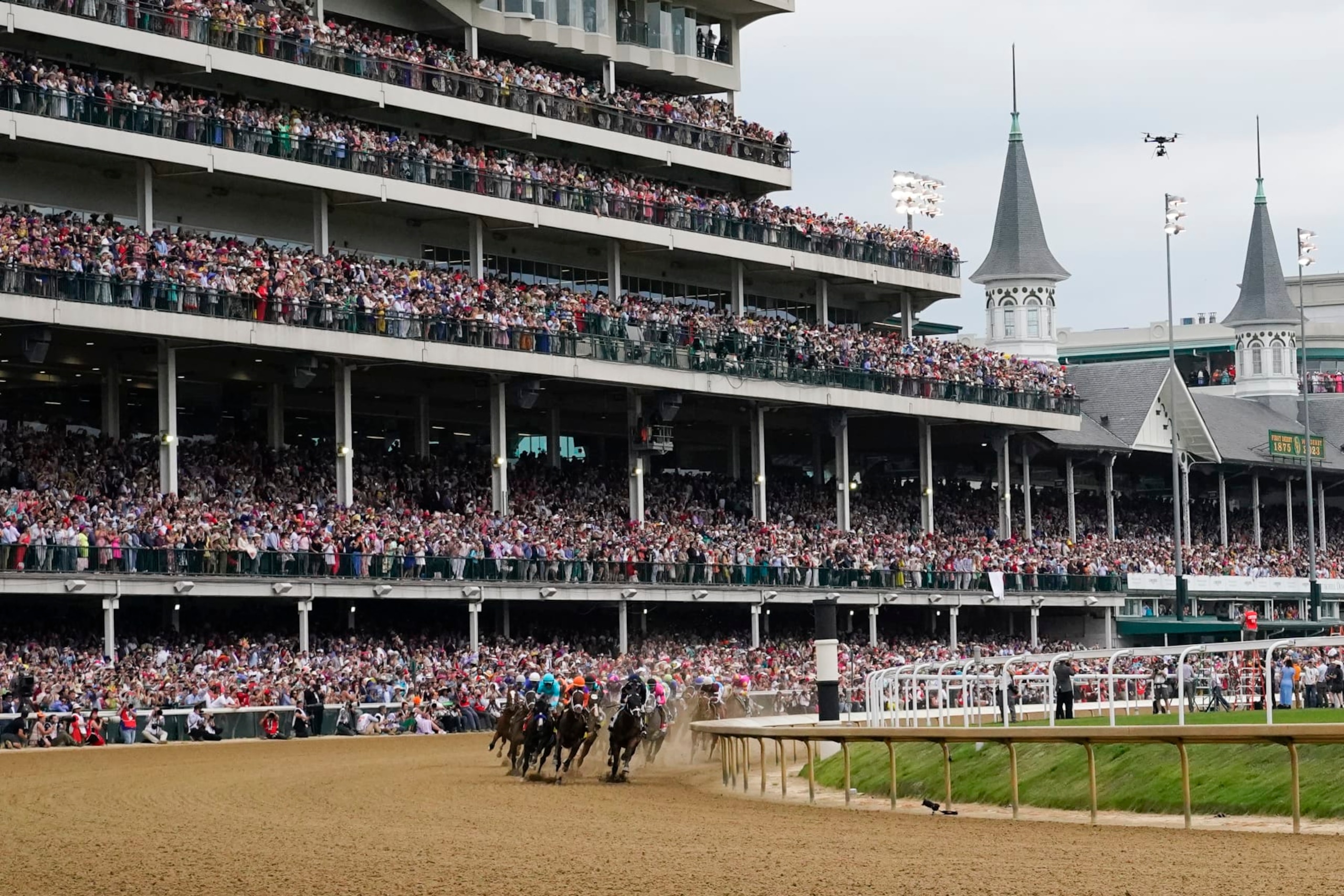 Horses make the first turn as they compete during the 149th running of the Kentucky Derby horse race at Churchill Downs Saturday, May 6, 2023, in Louisville, Ky. (AP Photo/Julio Cortez)