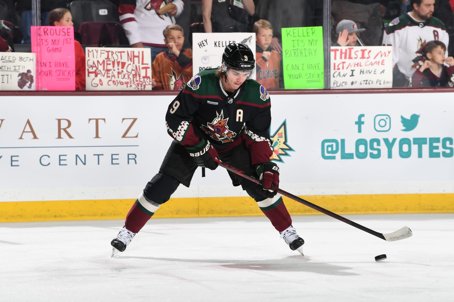 TEMPE, ARIZONA - APRIL 13: Clayton Keller #9 of the Arizona Coyotes stick-handles a puck during warmups prior to a game against the Vancouver Canucks at Mullett Arena on April 13, 2023 in Tempe, Arizona. (Photo by Norm Hall/NHLI via Getty Images)