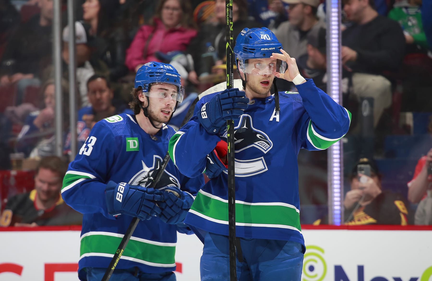 VANCOUVER, CANADA - FEBRUARY 15: Quinn Hughes #43 andElias Pettersson #40 of the Vancouver Canucks skate up ice during their NHL game against the New York Rangers at Rogers Arena February 15, 2023 in Vancouver, British Columbia, Canada.  (Photo by Jeff Vinnick/NHLI via Getty Images)