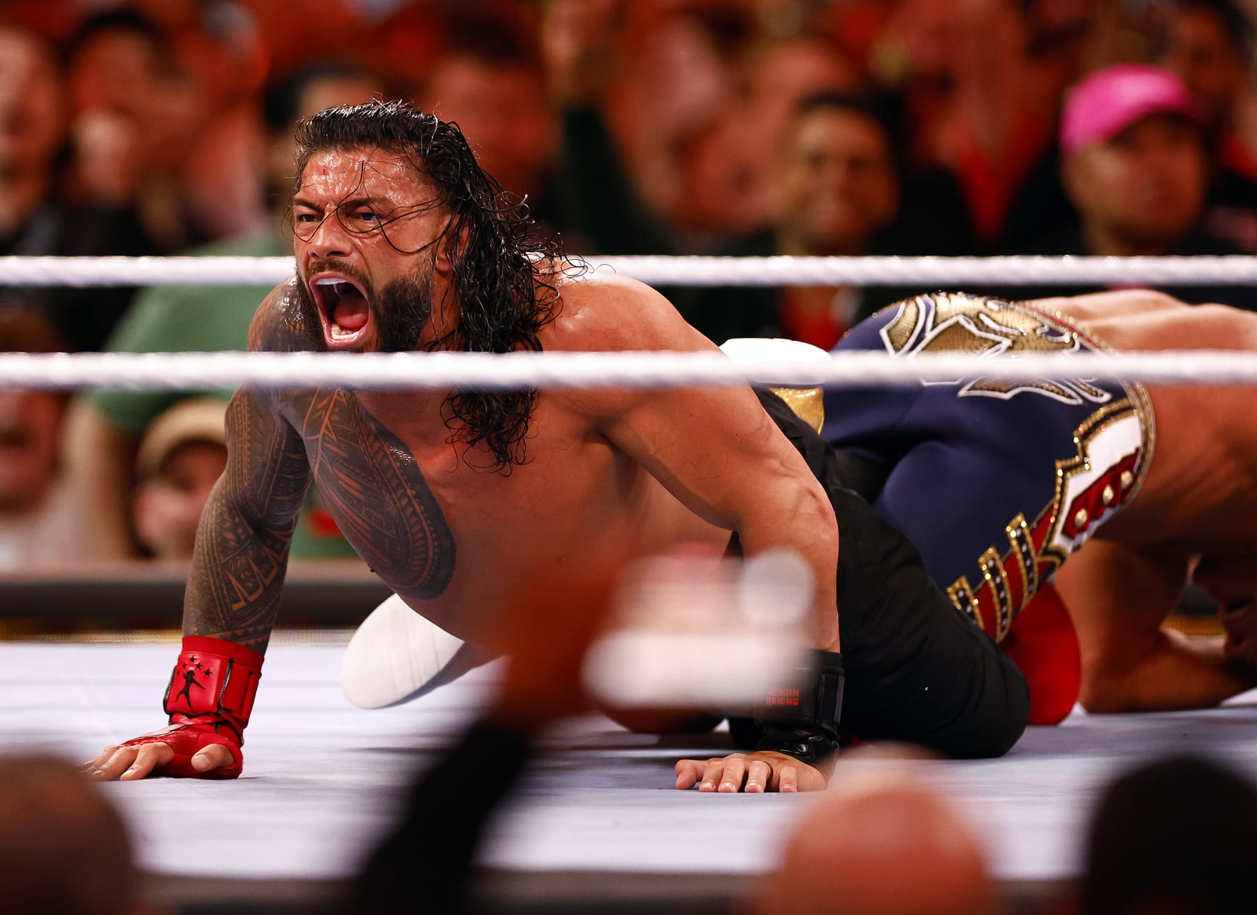 INGLEWOOD, CALIFORNIA - APRIL 02:  (L-R) Roman Reigns wrestles Cody Rhodes for Undisputed WWE Universal Title Match during WrestleMania Goes Hollywood at SoFi Stadium on April 02, 2023 in Inglewood, California.  (Photo by Ronald Martinez/Getty Images)