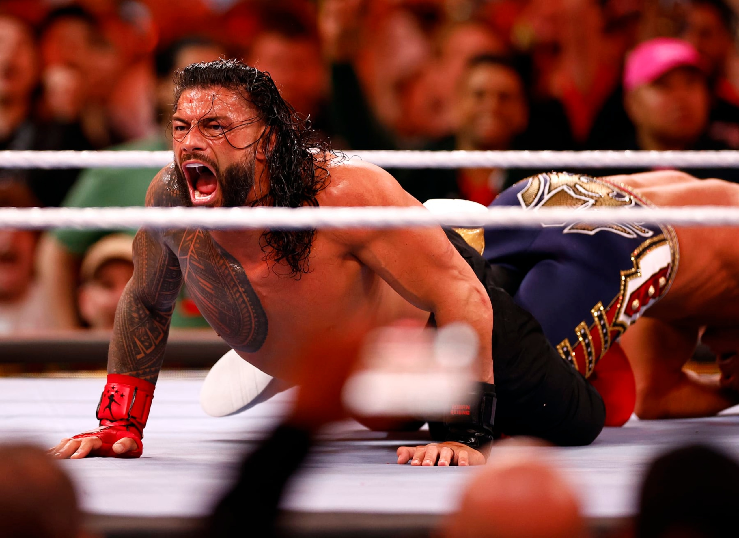 INGLEWOOD, CALIFORNIA - APRIL 02:  (L-R) Roman Reigns wrestles Cody Rhodes for Undisputed WWE Universal Title Match during WrestleMania Goes Hollywood at SoFi Stadium on April 02, 2023 in Inglewood, California.  (Photo by Ronald Martinez/Getty Images)