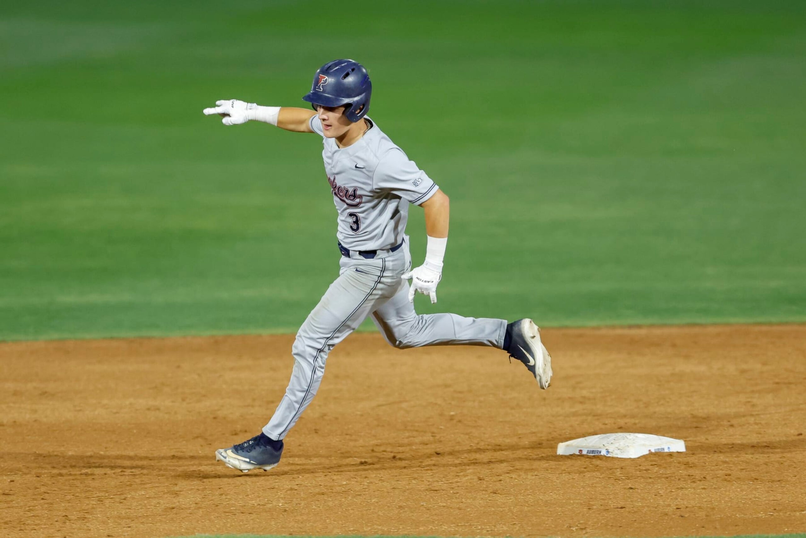 Penn's Jackson Appel (3) celebrates a two run home run during an NCAA baseball game against Auburn on Friday, June 2, 2023, in Auburn, Ala. (AP Photo/Stew Milne)