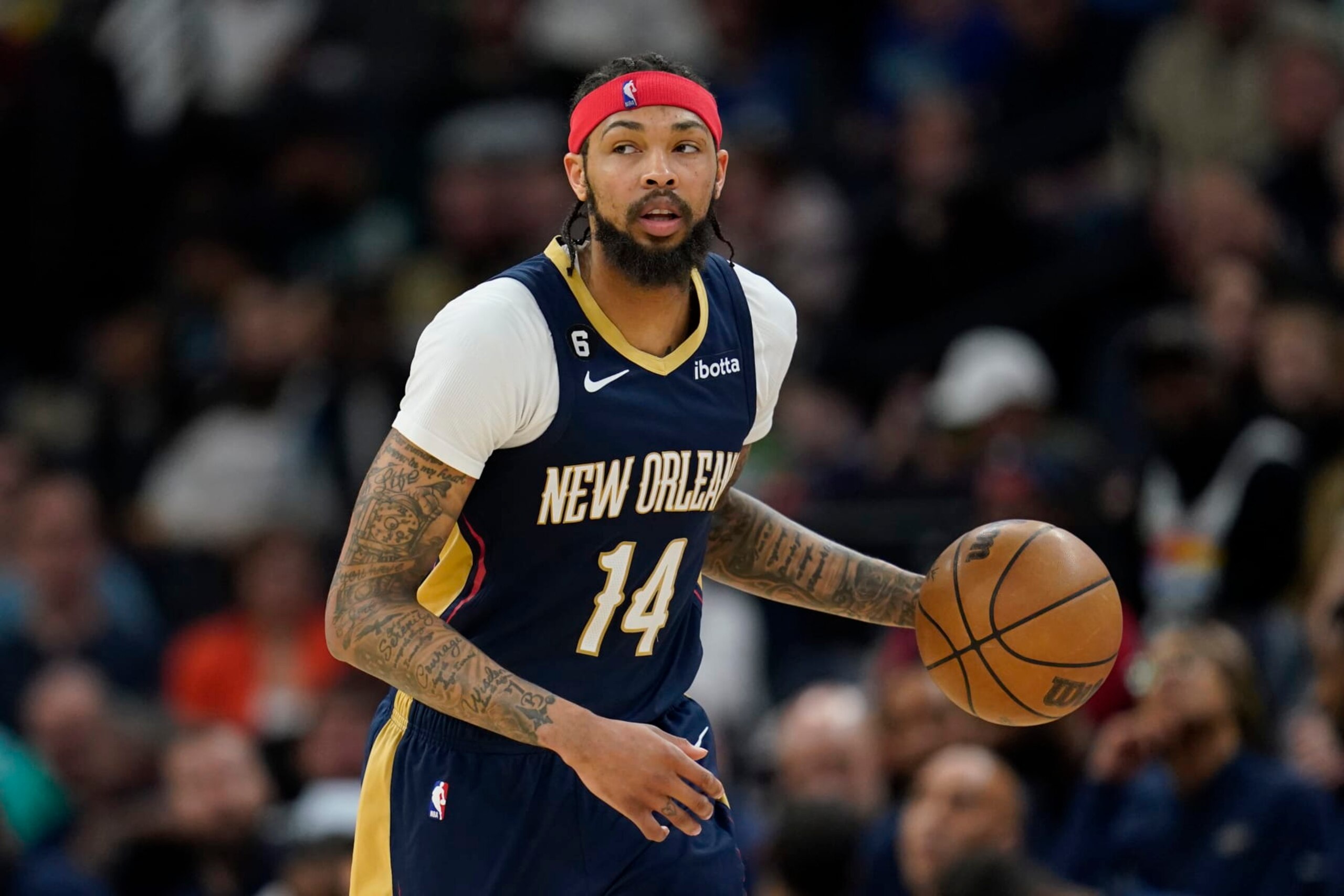 New Orleans Pelicans forward Brandon Ingram (14) dribbles toward the basket during the first half of an NBA basketball game against the Minnesota Timberwolves, Sunday, April 9, 2023, in Minneapolis. (AP Photo/Abbie Parr)