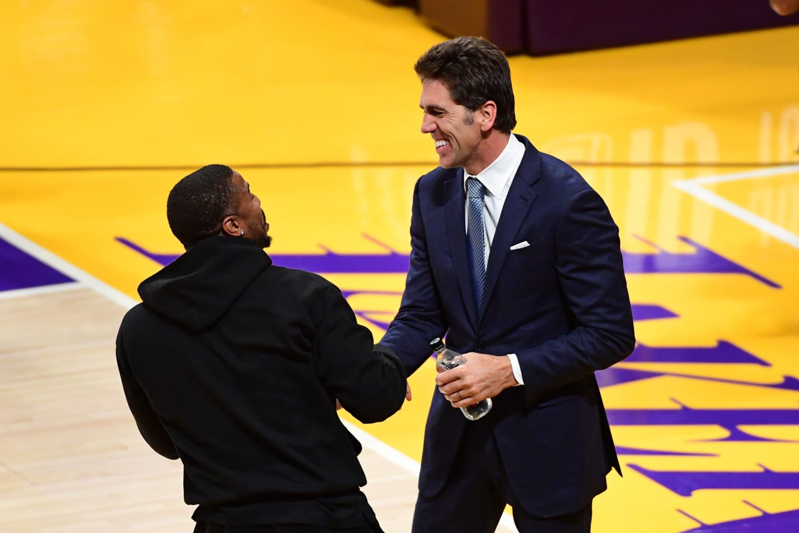 LOS ANGELES, CA - MAY 12: GM Bob Myers of the Golden State Warriors talks to Michael B. Jordan during Game of the Western Conference Semi-Finals of the 2023 NBA Playoffs between the Golden State Warriors and the Los Angeles Lakers on May 12, 2023 at Crypto.Com Arena in Los Angeles, California. NOTE TO USER: User expressly acknowledges and agrees that, by downloading and/or using this Photograph, user is consenting to the terms and conditions of the Getty Images License Agreement. Mandatory Copyright Notice: Copyright 2023 NBAE (Photo by Adam Pantozzi/NBAE via Getty Images) LOS ANGELES, CA - MAY 12: GM Bob Myers of the Golden State Warriors talks to Michael B. Jordan during Game of the Western Conference Semi-Finals of the 2023 NBA Playoffs between the Golden State Warriors and the Los Angeles Lakers on May 12, 2023 at Crypto.Com Arena in Los Angeles, California. NOTE TO USER: User expressly acknowledges and agrees that, by downloading and/or using this Photograph, user is consenting to the terms and conditions of the Getty Images License Agreement. Mandatory Copyright Notice: Copyright 2023 NBAE (Photo by Adam Pantozzi/NBAE via Getty Images)