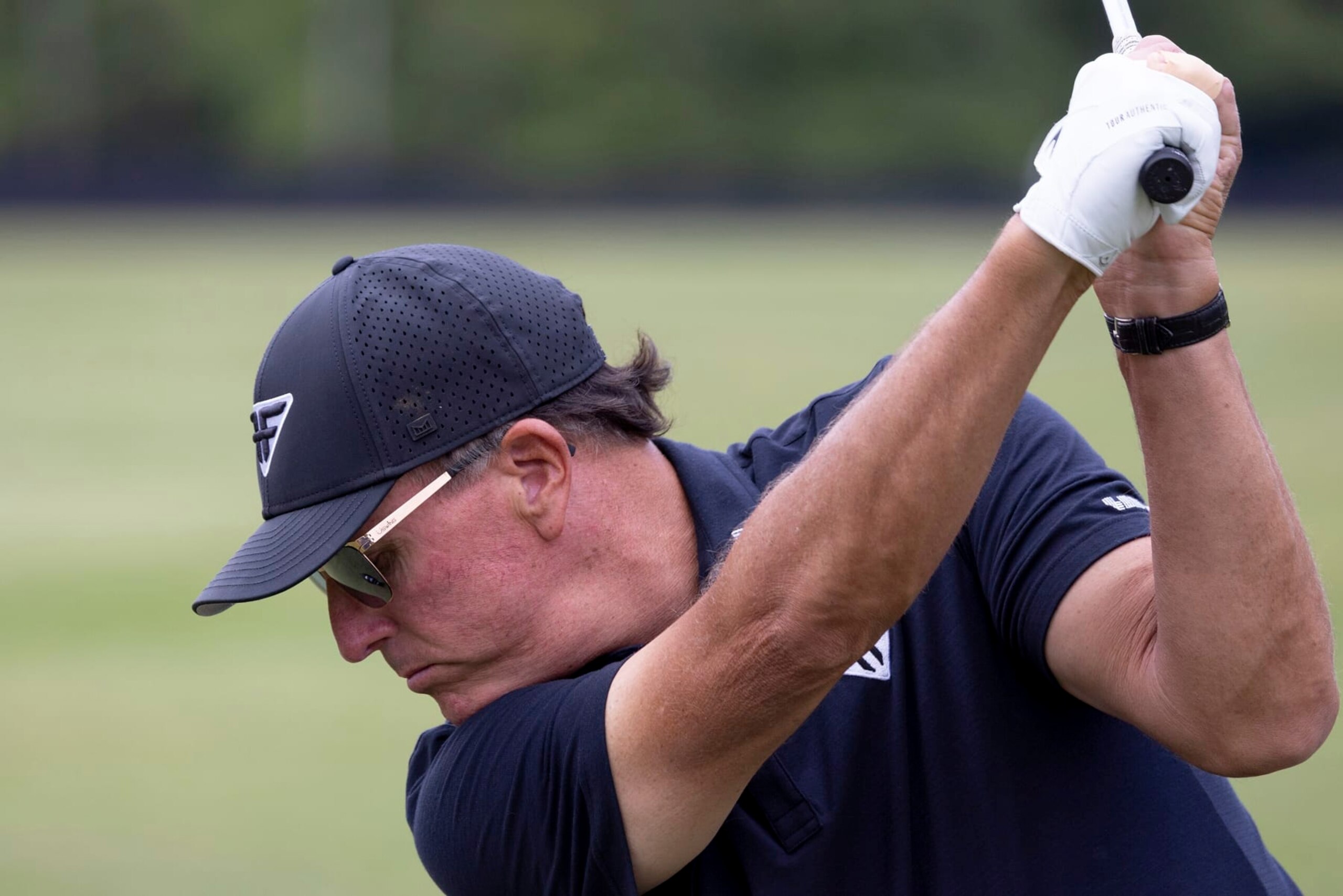 Captain Phil Mickelson of HyFlyers GC plays a shot on the driving range before the final round of LIV Golf DC at the Trump National Golf Club Washington DC on Sunday, May 28, 2023 in Sterling, Virginia. (Photo by LIV Golf via AP)