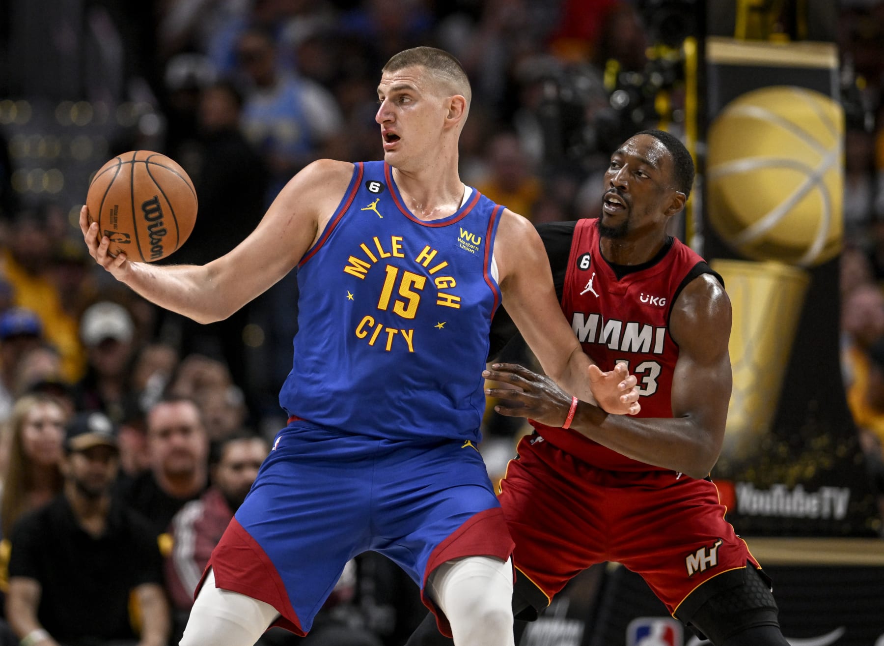 Nikola JokiÄ of the Nuggets and Bam Adebayo of the Heat