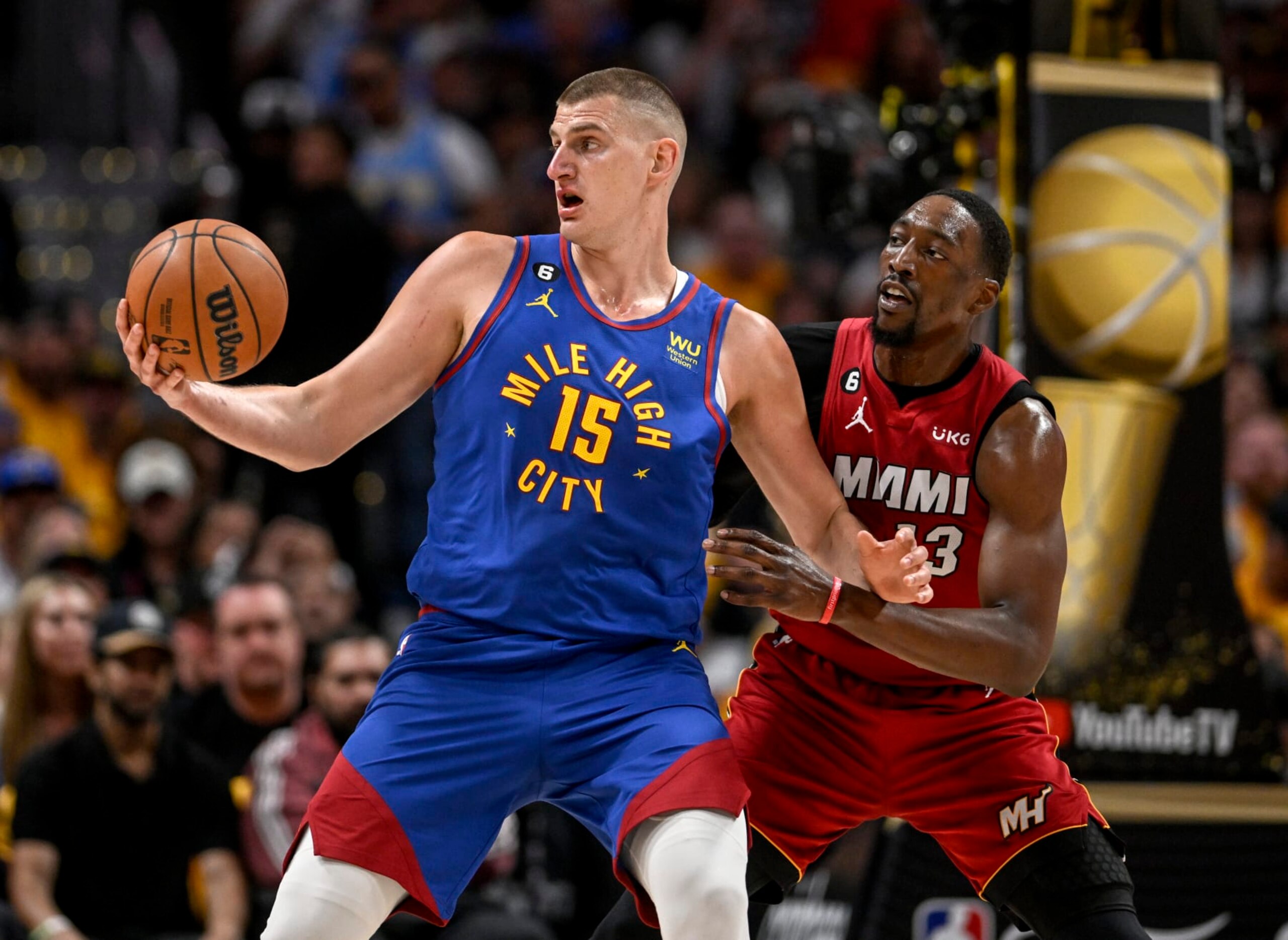 Nikola JokiÄ of the Nuggets and Bam Adebayo of the Heat