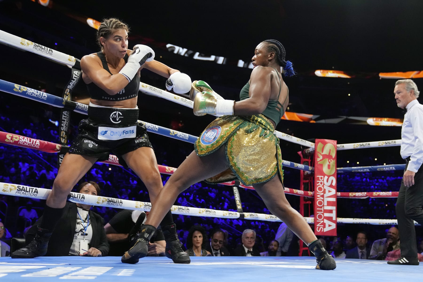 Claressa Shields, right, fights Maricela Cornejo during a middleweight boxing bout Saturday, June 3, 2023, in Detroit. (AP Photo/Carlos Osorio)
