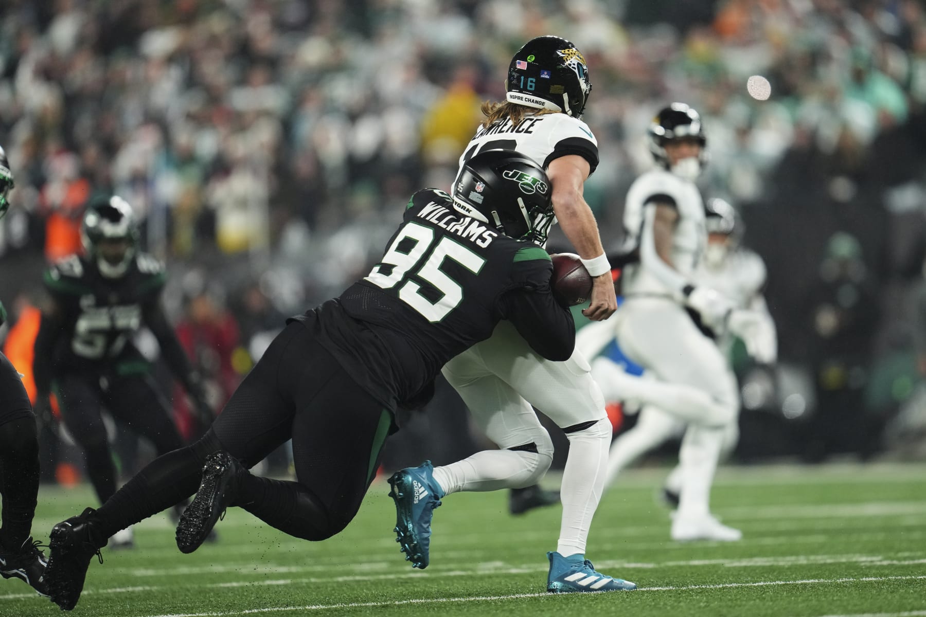 EAST RUTHERFORD, NJ - DECEMBER 22: Quinnen Williams #95 of the New York Jets strip sacks Trevor Lawrence #16 of the Jacksonville Jaguars at MetLife Stadium on December 22, 2022 in East Rutherford, New Jersey. (Photo by Cooper Neill/Getty Images)