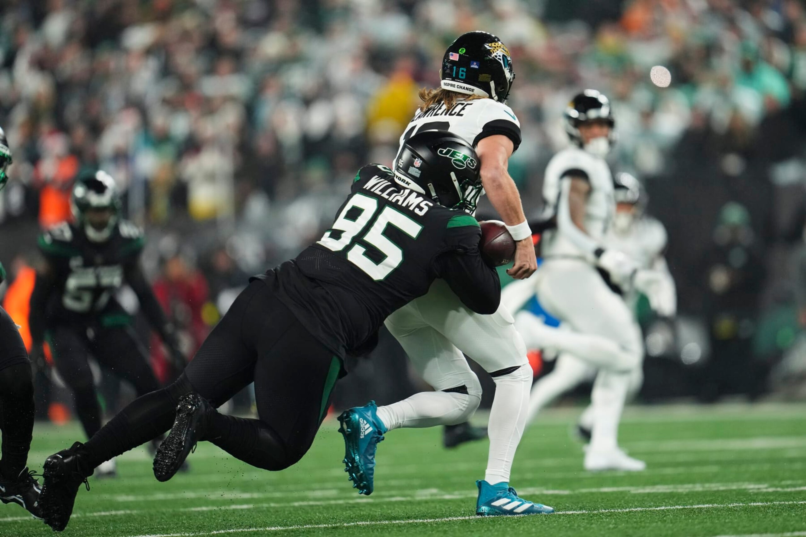 EAST RUTHERFORD, NJ - DECEMBER 22: Quinnen Williams #95 of the New York Jets strip sacks Trevor Lawrence #16 of the Jacksonville Jaguars at MetLife Stadium on December 22, 2022 in East Rutherford, New Jersey. (Photo by Cooper Neill/Getty Images)