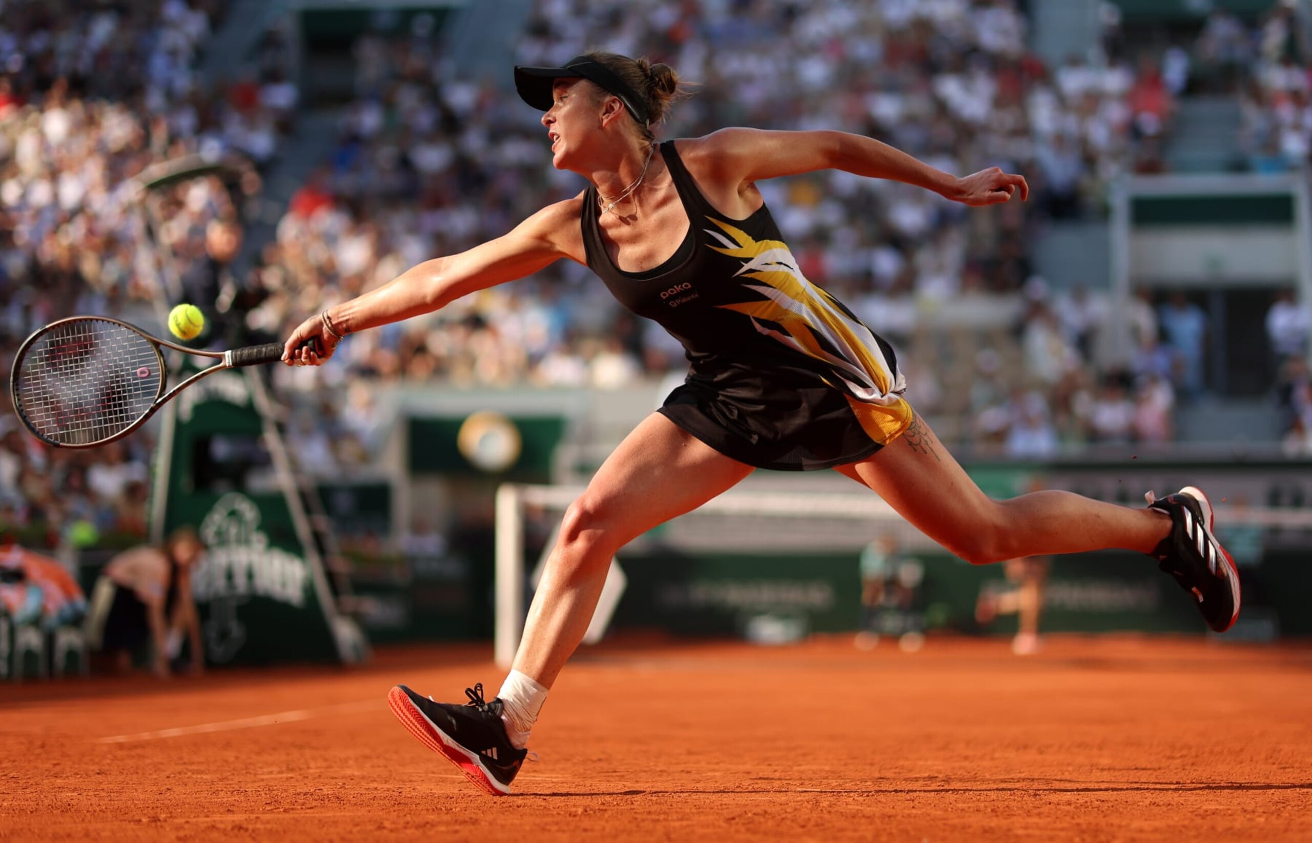 PARIS, FRANCE - JUNE 04: Elina Svitolina of Ukraine plays a backhand against Darya Kasatkina during the Women's Singles Fourth Round match on Day Eight of the 2023 French Open at Roland Garros on June 04, 2023 in Paris, France. (Photo by Julian Finney/Getty Images)