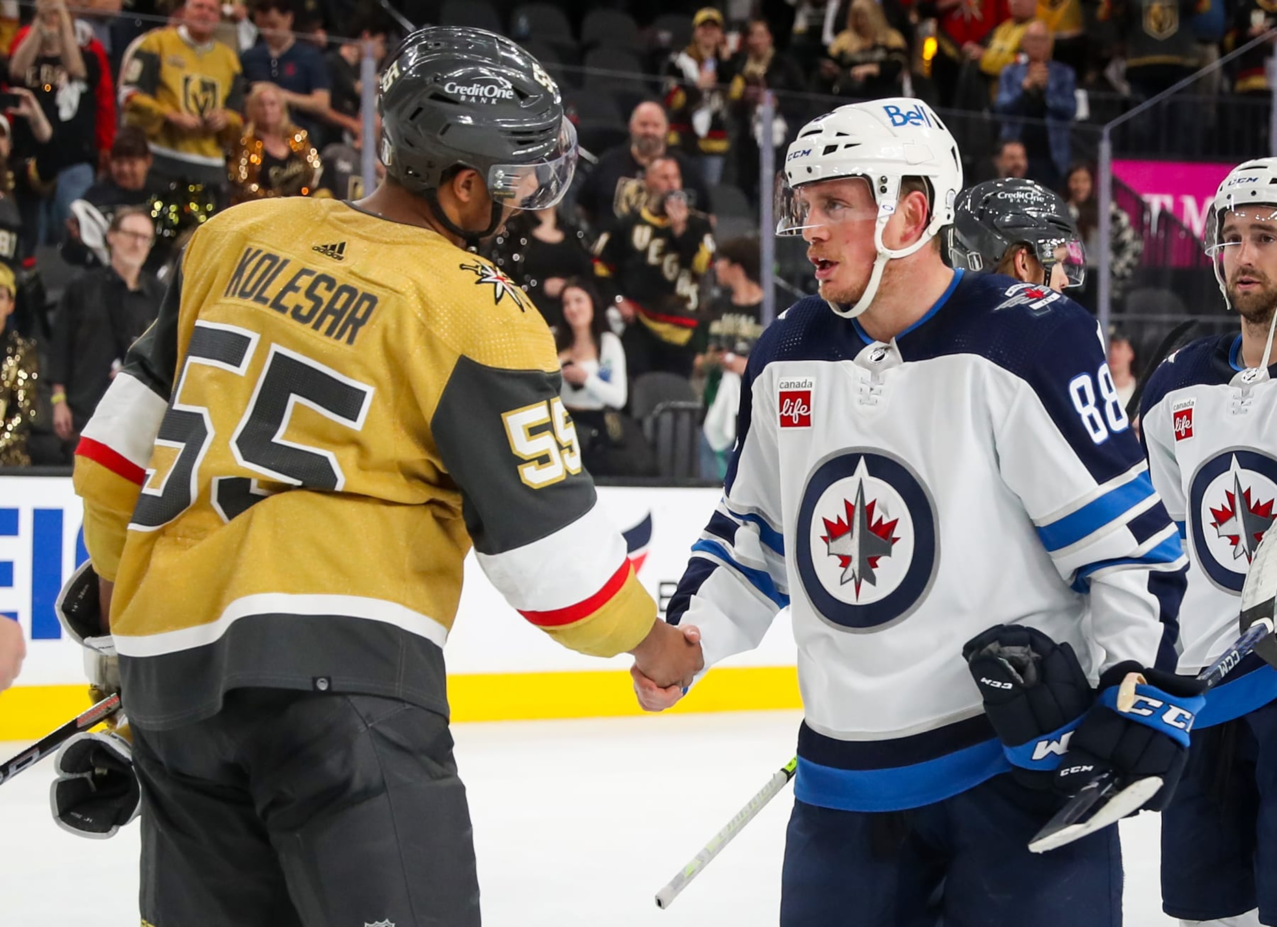 LAS VEGAS, NEVADA - APRIL 27: (L-R) Keegan Kolesar #55 of the Vegas Golden Knights and Nate Schmidt #88 of the Winnipeg Jets shake hands after the conclusion of Game Five of the First Round of the 2023 Stanley Cup Playoffs at T-Mobile Arena on April 27, 2023 in Las Vegas, Nevada. The Vegas Golden Knights defeated the Winnipeg Jets 4-1 in the game to win the series 4-1. (Photo by Zak Krill/NHLI via Getty Images)