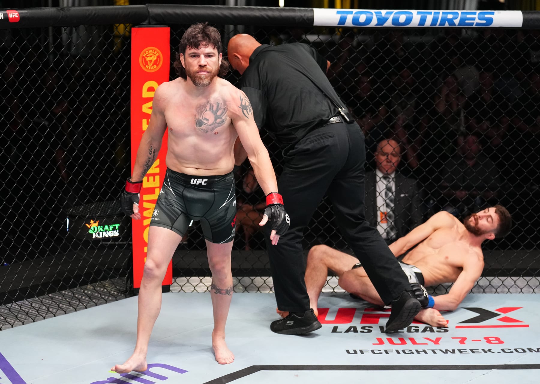 Jim Miller walks off after knocking out Jesse Butler. 