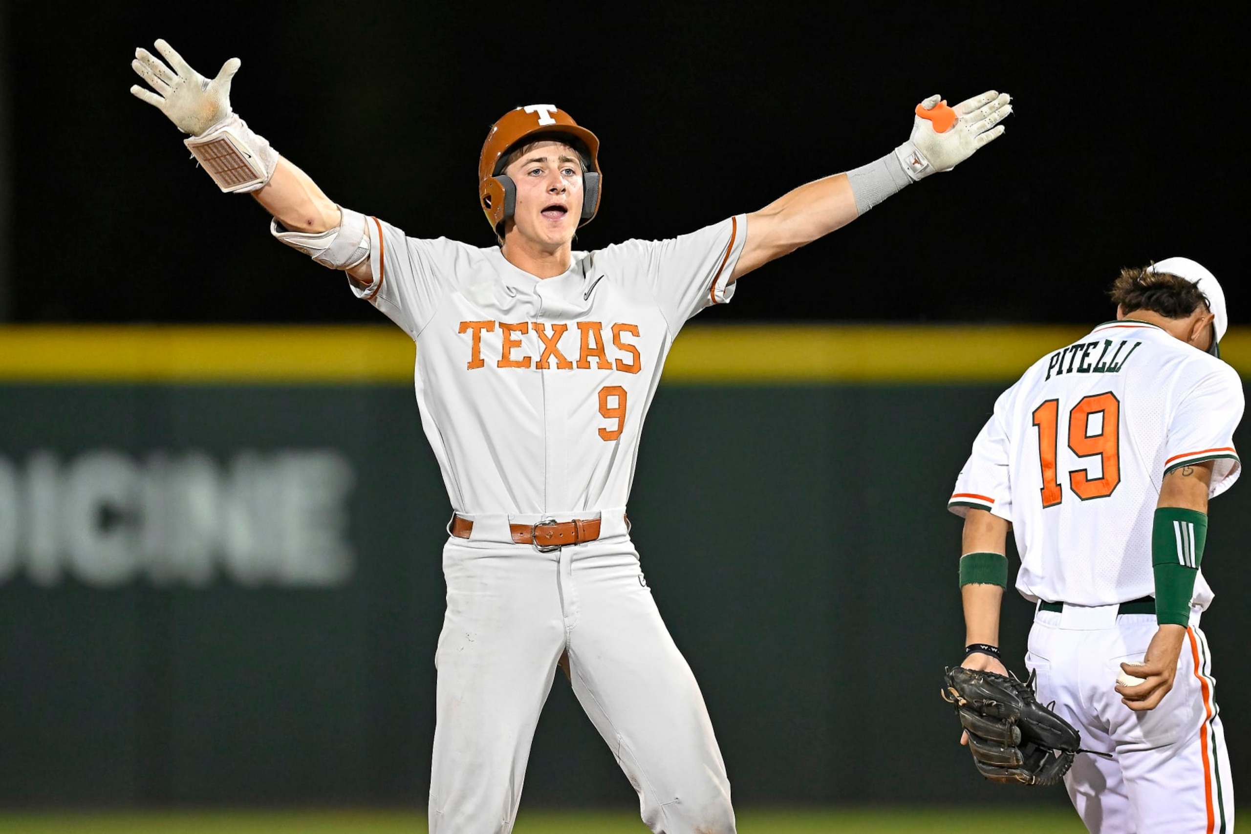 CORAL GABLES, FL - JUNE 03: Texas infielder/outfielder Jared Thomas (9) celebrates after hitting a lead-off double in the first inning as the Miami Hurricanes faced the Texas Longhorns in the Coral Gables Regional on June 3, 2023, at Mark Light Field at Alex Rodriguez Park in Coral Gables, Florida. (Photo by Samuel Lewis/Icon Sportswire via Getty Images)