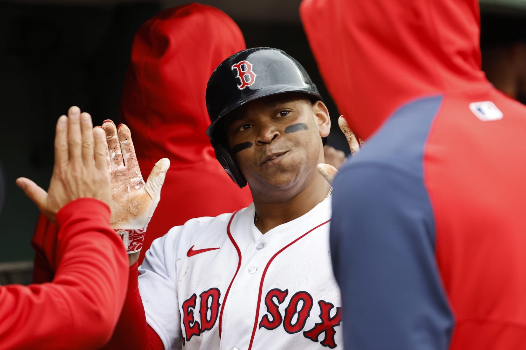 BOSTON, MA - JUNE 3: Rafael Devers #11 of the Boston Red Sox is congratulated in the dugout after scoring against the Tampa Bay Rays during the sixth inning at Fenway Park on June 3, 2023 in Boston, Massachusetts. (Photo By Winslow Townson/Getty Images)