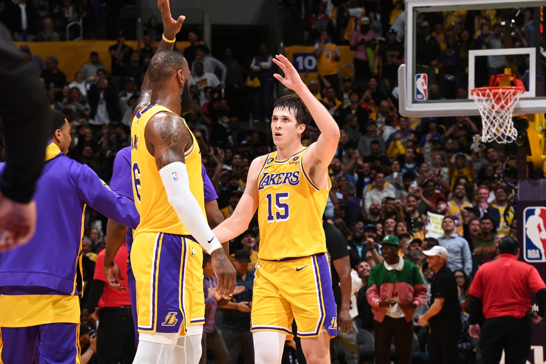LOS ANGELES, CA - MAY 12: LeBron James #6 of the Los Angeles Lakers high fives Austin Reaves #15 during Game 6 of the Western Conference Semi-Finals 2023 NBA Playoffs on May 12, 2023 at Crypto.Com Arena in Los Angeles, California. NOTE TO USER: User expressly acknowledges and agrees that, by downloading and/or using this Photograph, user is consenting to the terms and conditions of the Getty Images License Agreement. Mandatory Copyright Notice: Copyright 2023 NBAE (Photo by Andrew D. Bernstein/NBAE via Getty Images)
