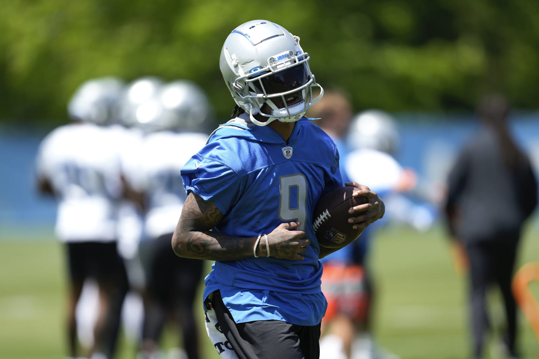Detroit Lions wide receiver Jameson Williams runs after a catch during an NFL football practice in Allen Park, Mich., Thursday, May 25, 2023. (AP Photo/Paul Sancya)