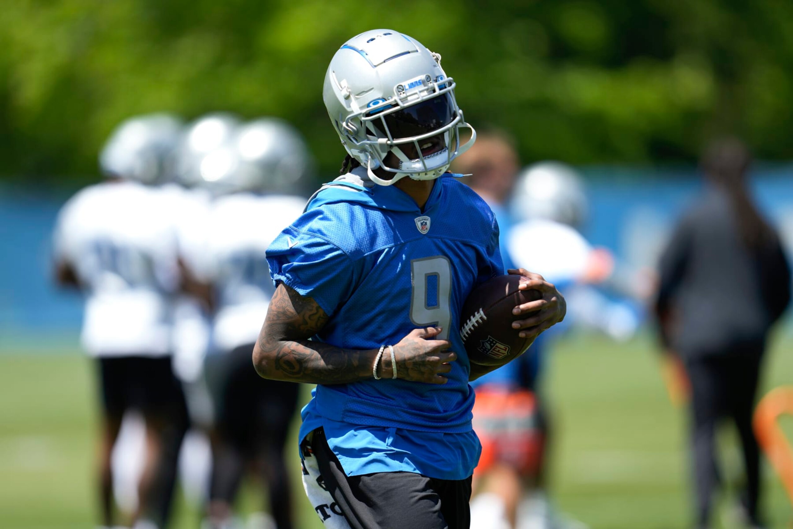 Detroit Lions wide receiver Jameson Williams runs after a catch during an NFL football practice in Allen Park, Mich., Thursday, May 25, 2023. (AP Photo/Paul Sancya)