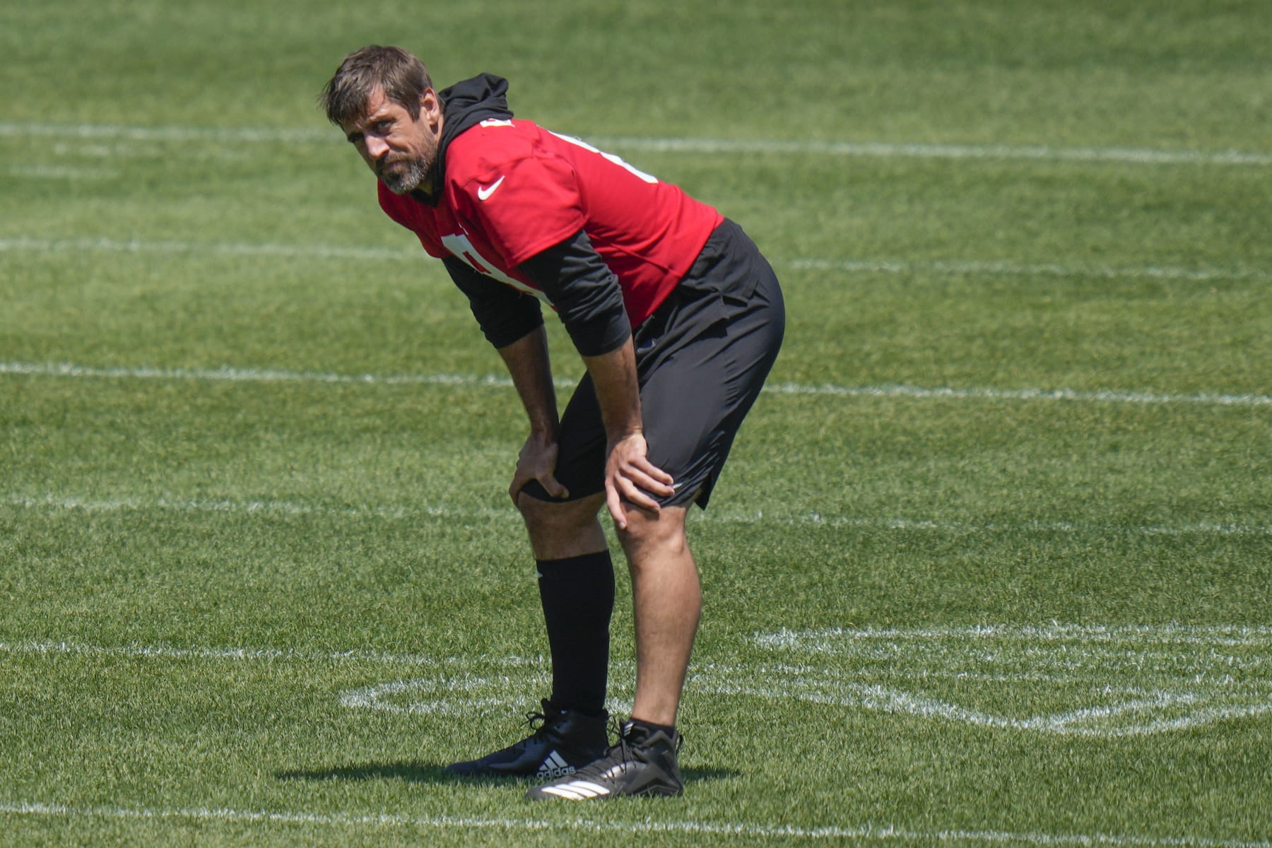 New York Jets quarterback Aaron Rodgers watches teammates run drills at the NFL football team's training facility in Florham Park, N.J., Wednesday, May 31, 2023. (AP Photo/Seth Wenig)