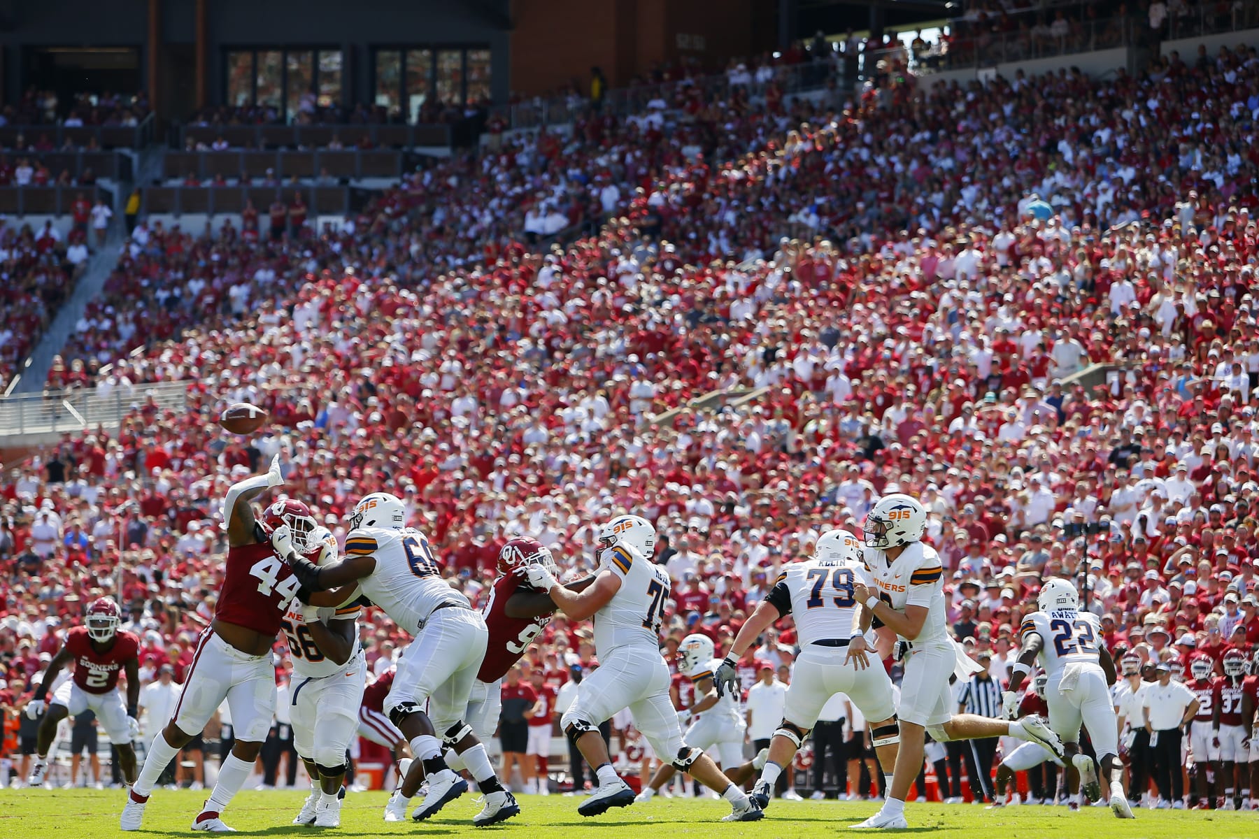 NORMAN, OK - SEPTEMBER 3:  Defensive lineman Kelvin Gilliam #44 of the Oklahoma Sooners tries to get his hands up on the pass by quarterback Gavin Hardison #2 of the UTEP Miners in the fourth quarter at Gaylord Family Oklahoma Memorial Stadium on September 3, 2022 in Norman, Oklahoma.  Oklahoma won 45-13.  (Photo by Brian Bahr/Getty Images)