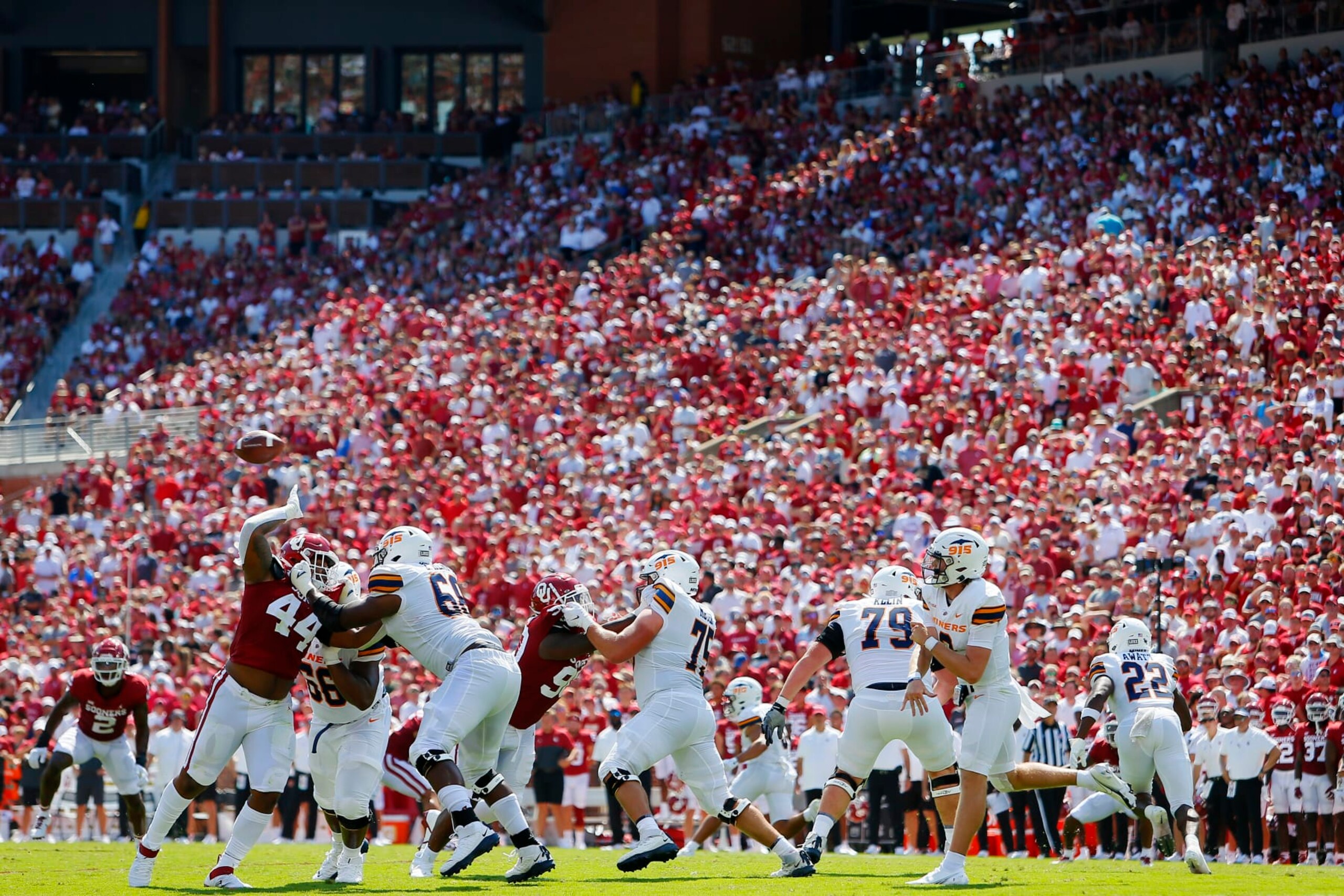 NORMAN, OK - SEPTEMBER 3:  Defensive lineman Kelvin Gilliam #44 of the Oklahoma Sooners tries to get his hands up on the pass by quarterback Gavin Hardison #2 of the UTEP Miners in the fourth quarter at Gaylord Family Oklahoma Memorial Stadium on September 3, 2022 in Norman, Oklahoma.  Oklahoma won 45-13.  (Photo by Brian Bahr/Getty Images)