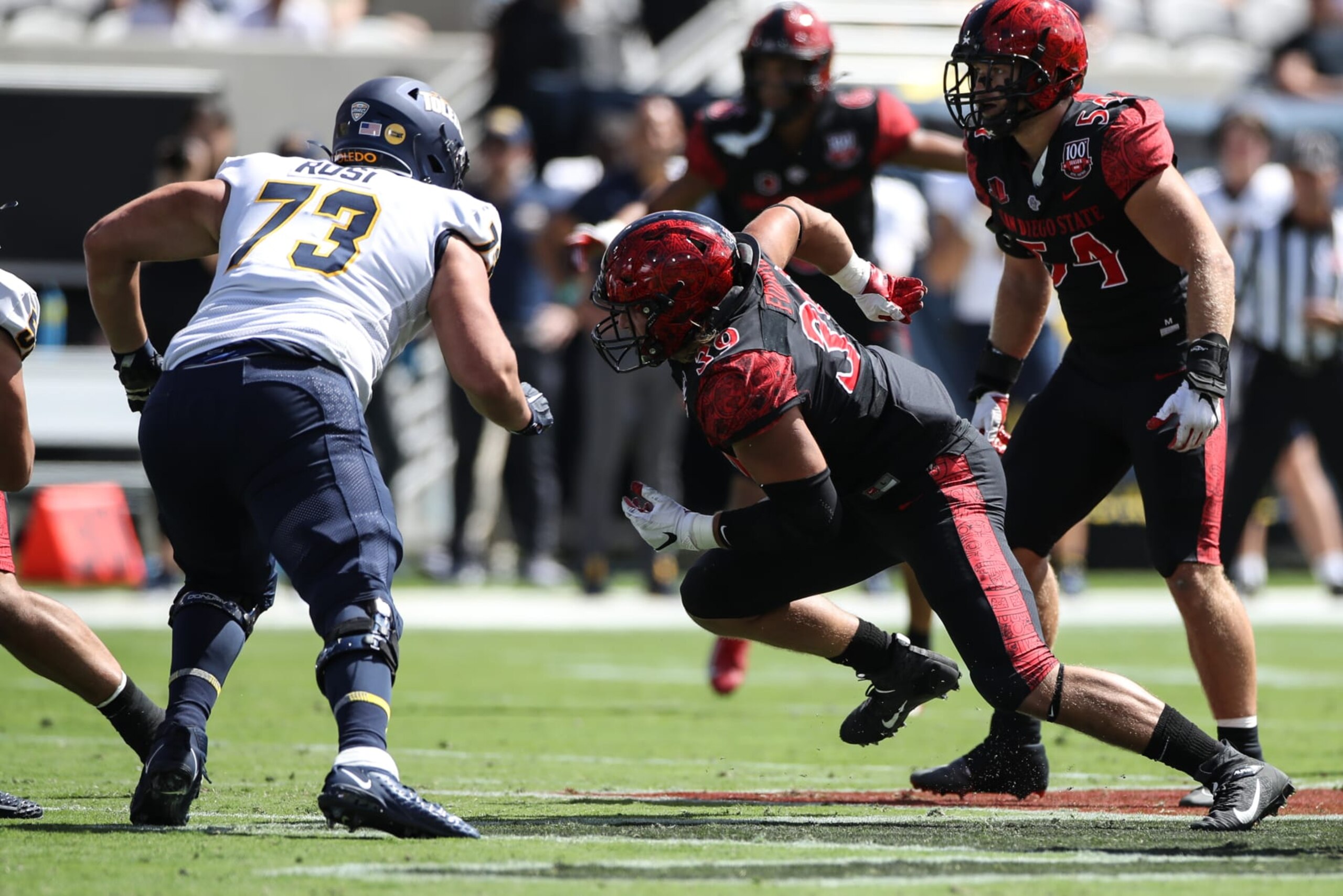 SAN DIEGO, CA - SEPTEMBER 24: San Diego State Aztecs defensive lineman Garret Fountain (39) gets off on Toledo Rockets offensive lineman Nick Rosi (73)  during a college football game between the Toledo Rockets and the San Diego State Aztecs on September 24, 2022, at Snapdragon Stadium in San Diego, CA. (Photo by Jevone Moore/Icon Sportswire via Getty Images)