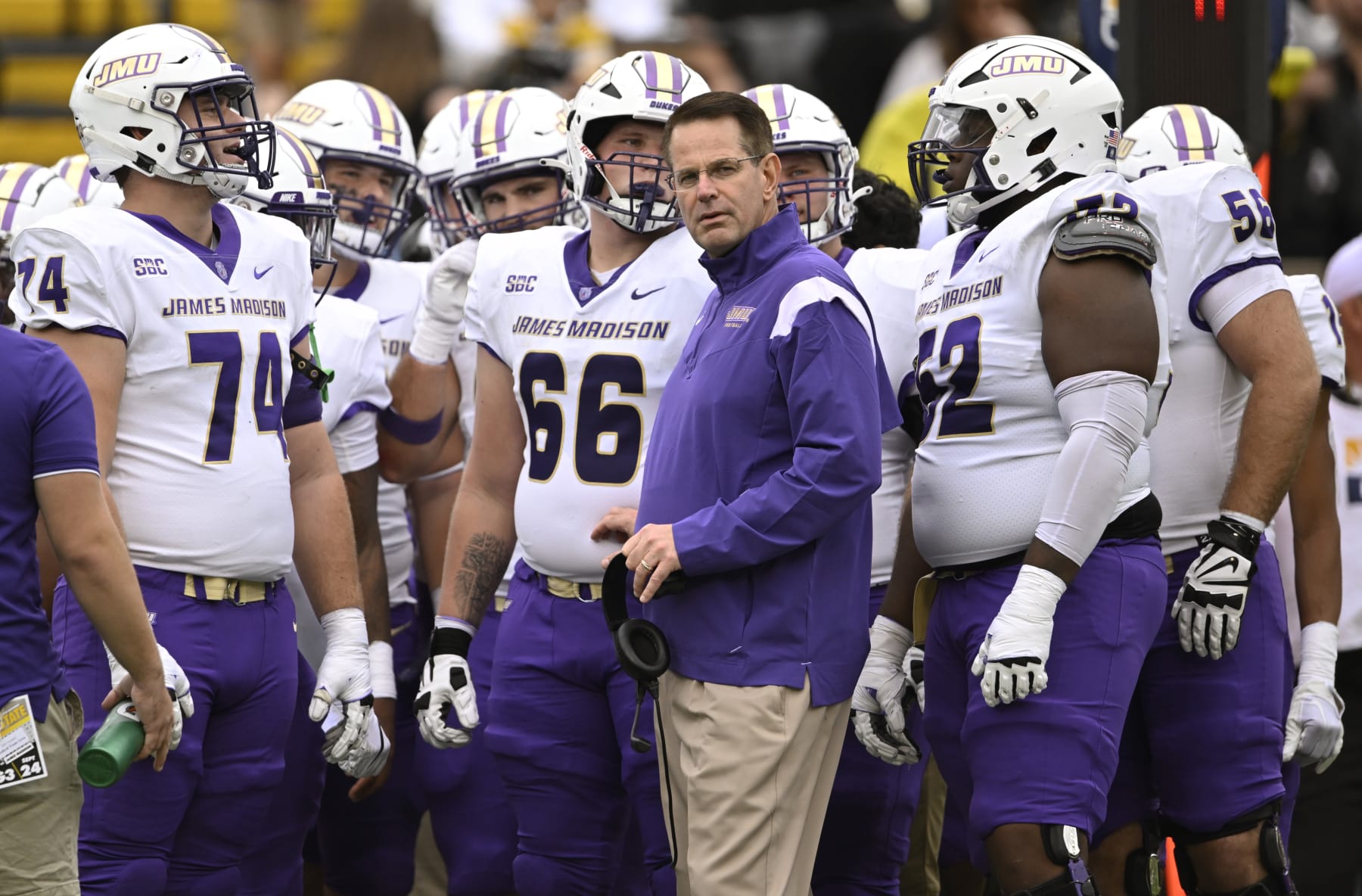 BOONE, NORTH CAROLINA - SEPTEMBER 24: Head coach Curt Cignetti of the James Madison Dukes stands with his team during a first quarter timeout against the Appalachian State Mountaineers at Kidd Brewer Stadium on September 24, 2022 in Boone, North Carolina. (Photo by Eakin Howard/Getty Images)