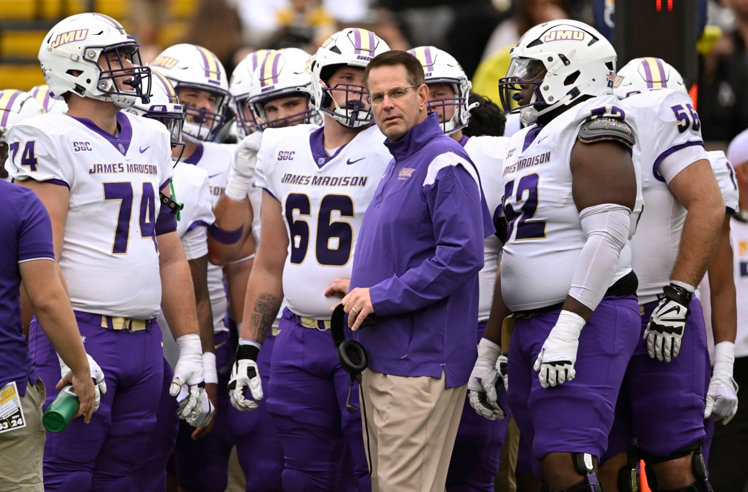BOONE, NORTH CAROLINA - SEPTEMBER 24: Head coach Curt Cignetti of the James Madison Dukes stands with his team during a first quarter timeout against the Appalachian State Mountaineers at Kidd Brewer Stadium on September 24, 2022 in Boone, North Carolina. (Photo by Eakin Howard/Getty Images)