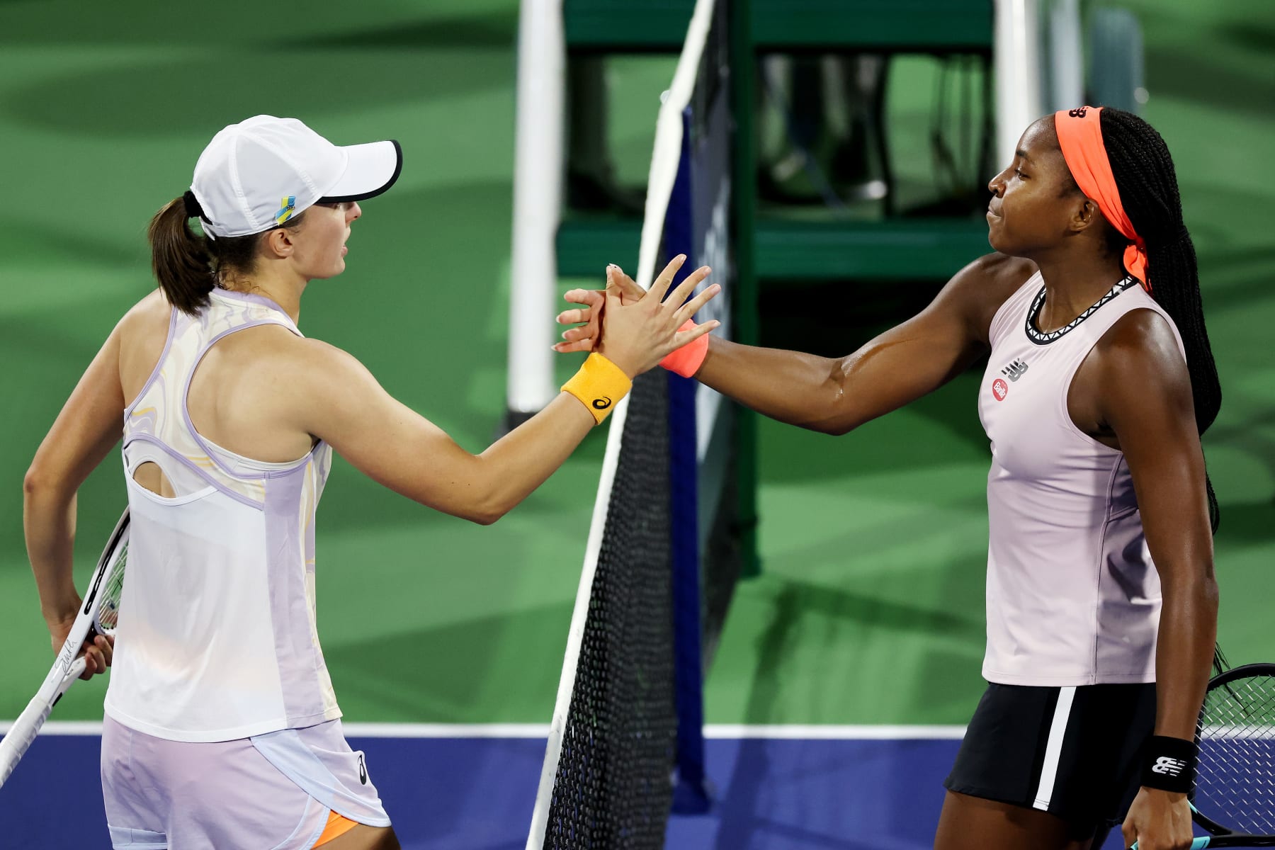 DUBAI, UNITED ARAB EMIRATES - FEBRUARY 24: Iga Swiatek of Poland shakes hands after defeating Coco Gauff of USA during their women's singles semi-final match on day six of the Dubai Duty Free Tennis at Dubai Duty Free Tennis Stadium on February 24, 2023 in Dubai, United Arab Emirates. (Photo by Christopher Pike/Getty Images)