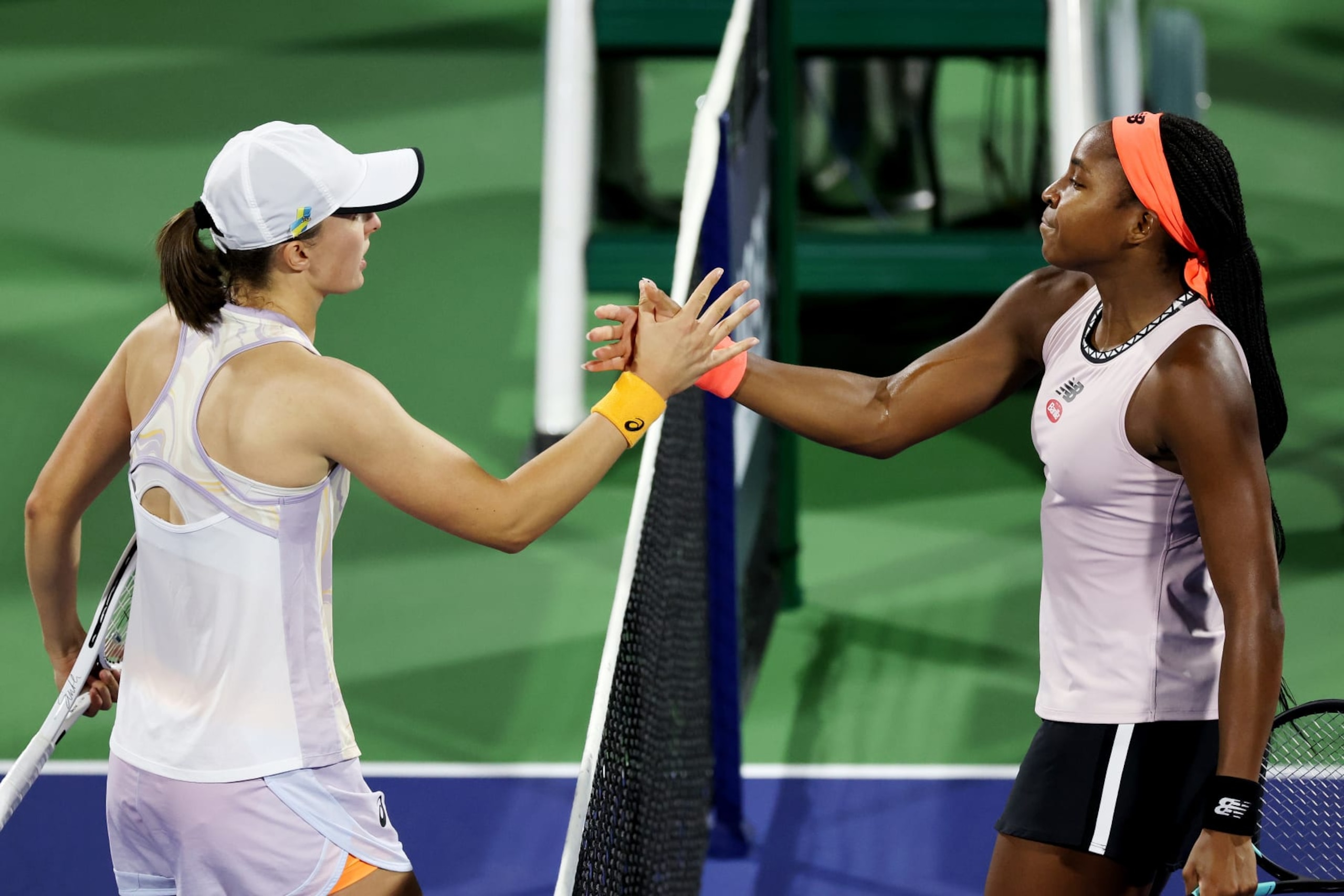 DUBAI, UNITED ARAB EMIRATES - FEBRUARY 24: Iga Swiatek of Poland shakes hands after defeating Coco Gauff of USA during their women's singles semi-final match on day six of the Dubai Duty Free Tennis at Dubai Duty Free Tennis Stadium on February 24, 2023 in Dubai, United Arab Emirates. (Photo by Christopher Pike/Getty Images) DUBAI, UNITED ARAB EMIRATES - FEBRUARY 24: Iga Swiatek of Poland shakes hands after defeating Coco Gauff of USA during their women's singles semi-final match on day six of the Dubai Duty Free Tennis at Dubai Duty Free Tennis Stadium on February 24, 2023 in Dubai, United Arab Emirates. (Photo by Christopher Pike/Getty Images)