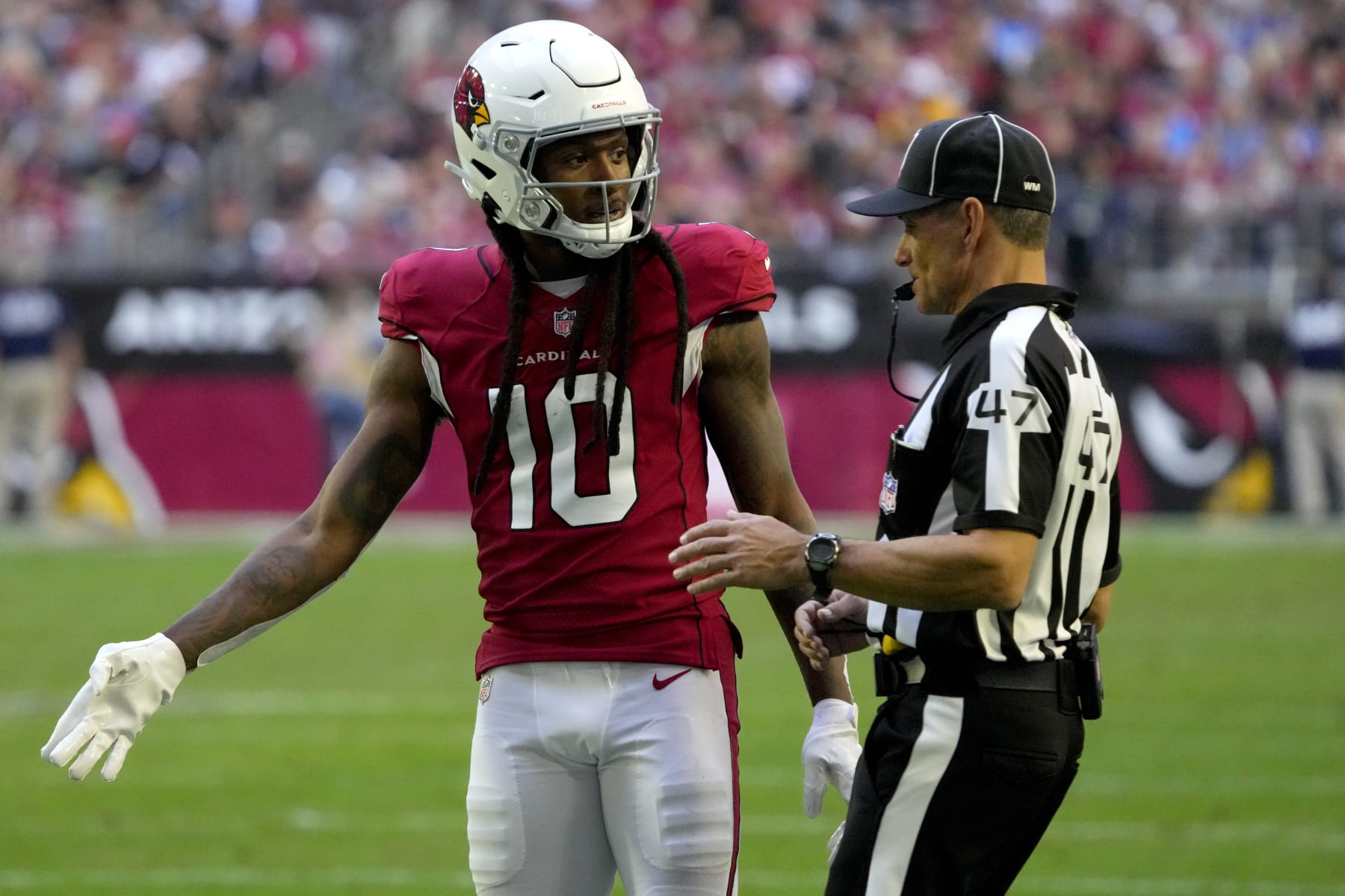 Arizona Cardinals wide receiver DeAndre Hopkins (10) argues a call with line judge Tim Podraza (47) during the second half of an NFL football game against the Los Angeles Chargers, Sunday, Nov. 27, 2022, in Glendale, Ariz. The Chargers defeated the Cardinals 25-24. (AP Photo/Rick Scuteri)