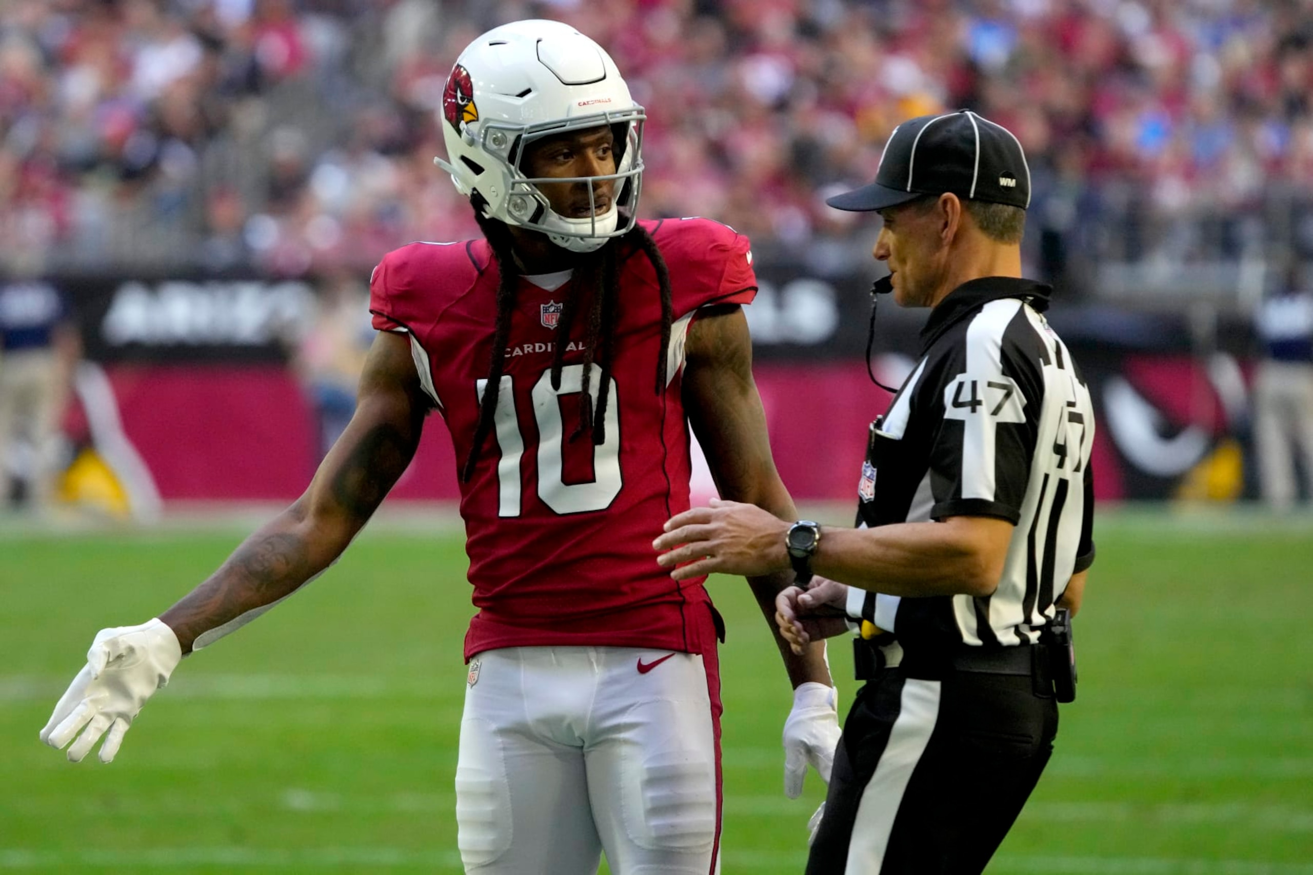 Arizona Cardinals wide receiver DeAndre Hopkins (10) argues a call with line judge Tim Podraza (47) during the second half of an NFL football game against the Los Angeles Chargers, Sunday, Nov. 27, 2022, in Glendale, Ariz. The Chargers defeated the Cardinals 25-24. (AP Photo/Rick Scuteri)