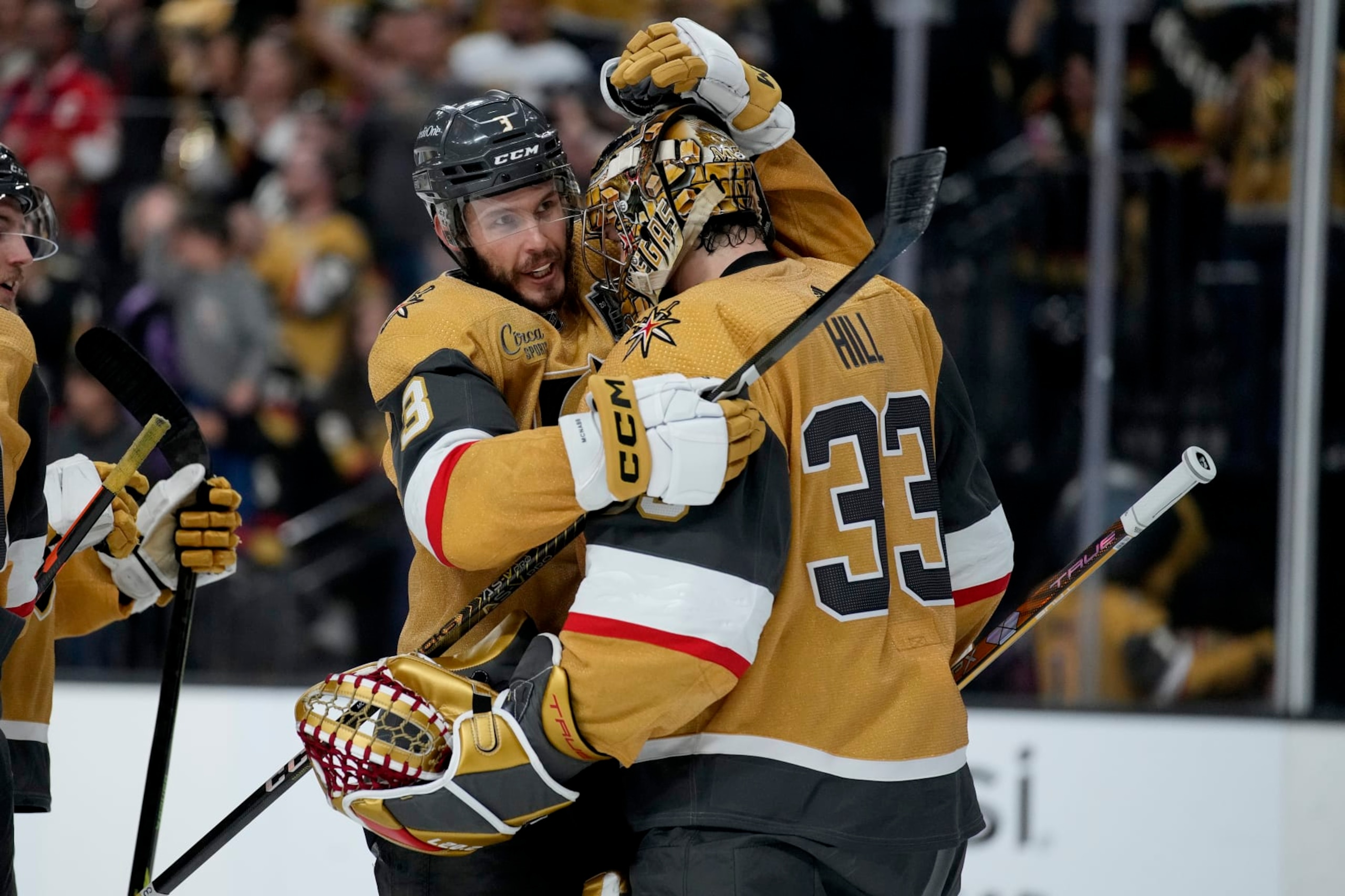 Vegas Golden Knights goaltender Adin Hill (33) and defenseman Brayden McNabb (3) celebrate after Game 2 of the NHL hockey Stanley Cup Finals against the Florida Panthers, Monday, June 5, 2023, in Las Vegas. The Golden Knights defeated the Panthers 7-2 to take a 2-0 series lead. (AP Photo/John Locher)