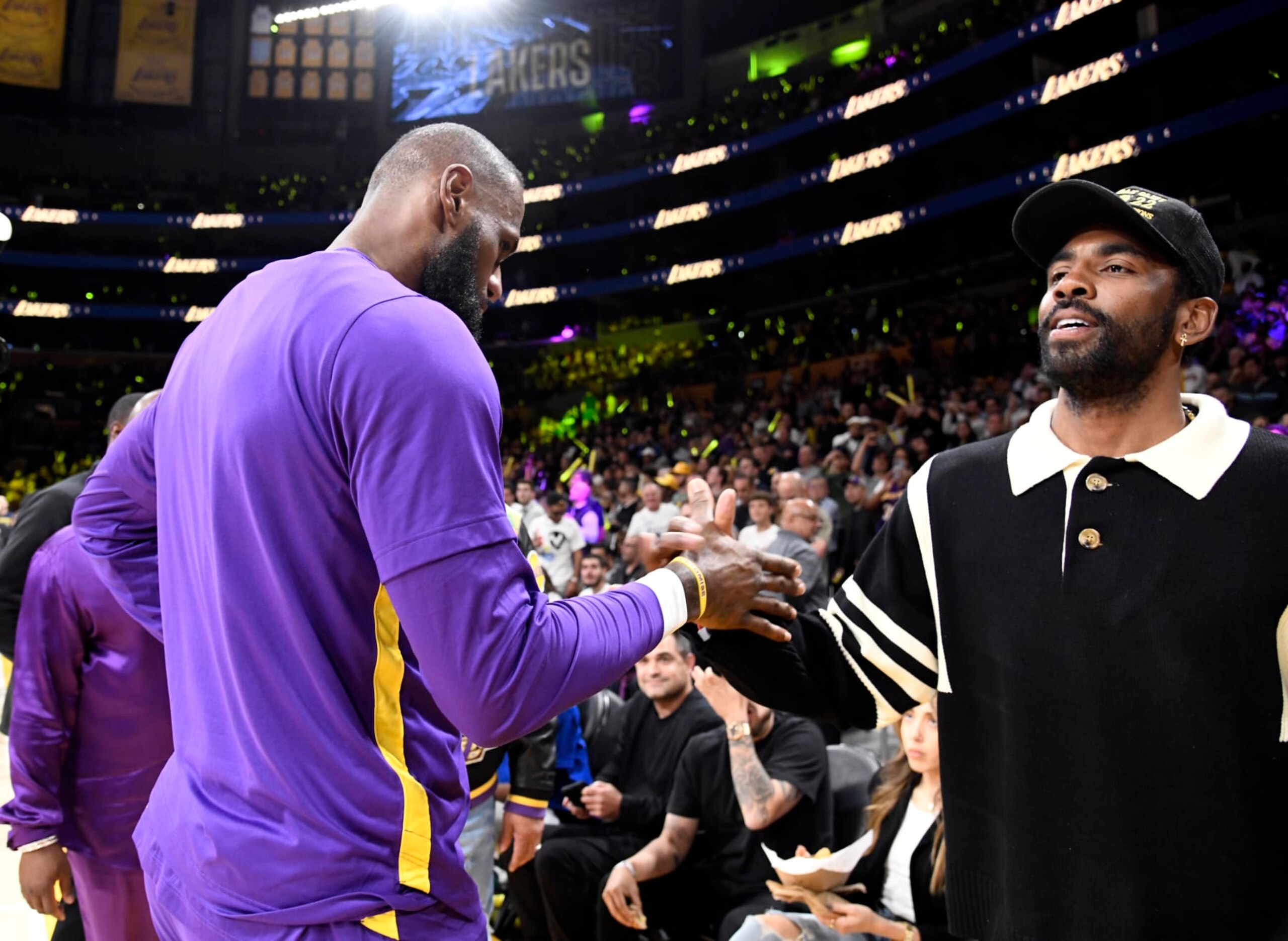 LOS ANGELES, CA - APRIL 28: Kyrie Irving #2 of the Dallas Mavericks greets LeBron James #6 of the Los Angeles Lakers as he attends a basketball game between Los Angeles Lakers and Memphis Grizzlies Round 1 Game 6 of the 2023 NBA Playoffs against Los Angeles Lakers at Crypto.com Arena on April 28, 2023 in Los Angeles, California. (Photo by Kevork Djansezian/Getty Images)