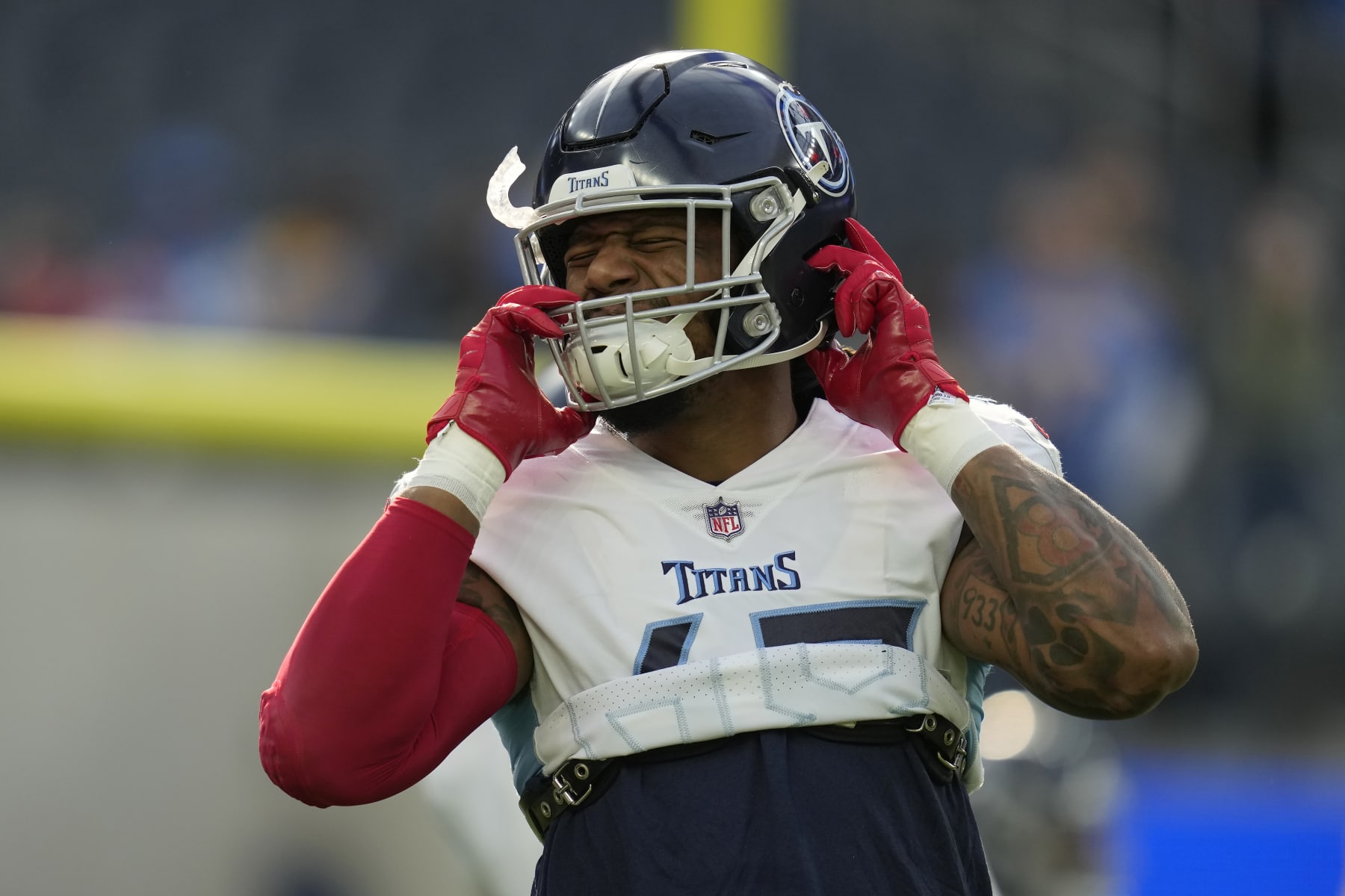Tennessee Titans linebacker Bud Dupree warms up before an NFL football game against the Los Angeles Chargers in Inglewood, Calif., Sunday, Dec. 18, 2022. (AP Photo/Ashley Landis)