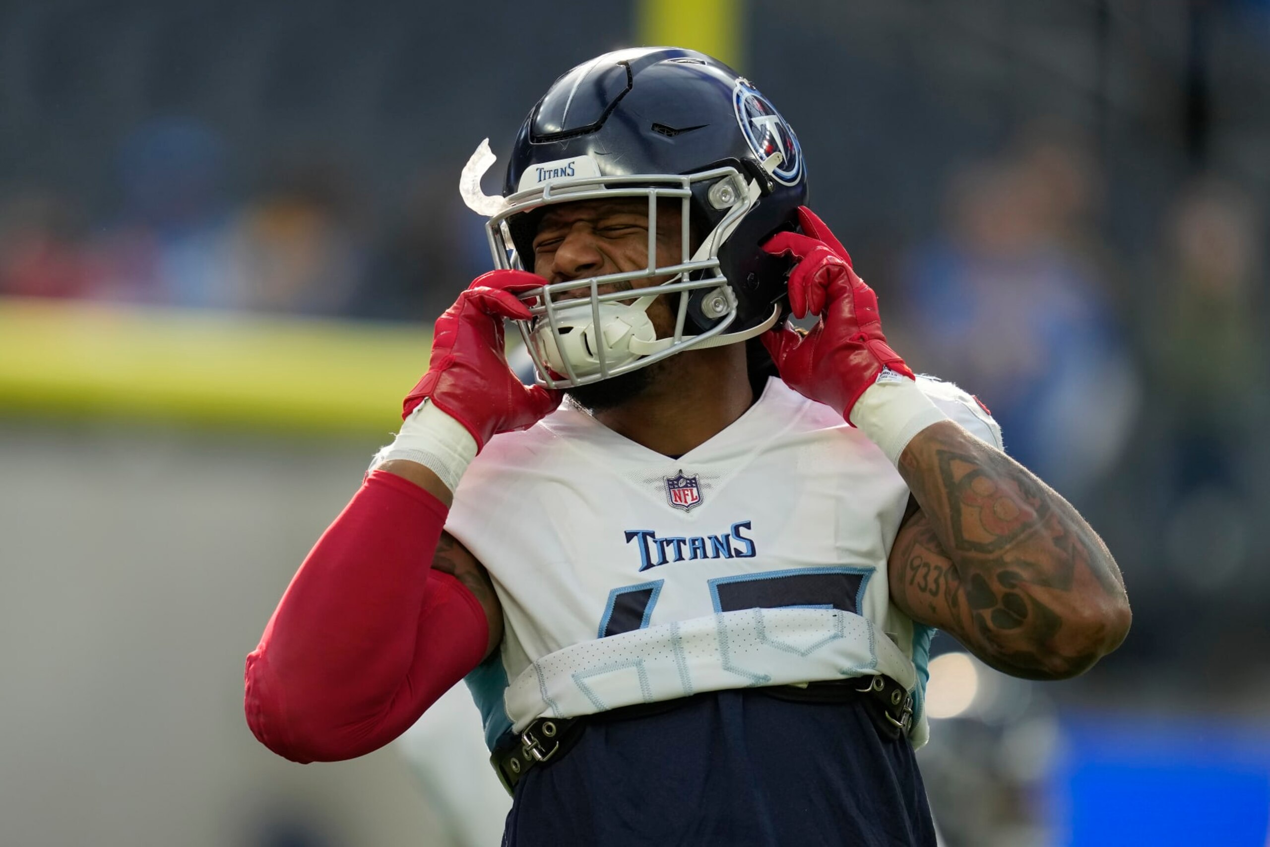 Tennessee Titans linebacker Bud Dupree warms up before an NFL football game against the Los Angeles Chargers in Inglewood, Calif., Sunday, Dec. 18, 2022. (AP Photo/Ashley Landis)