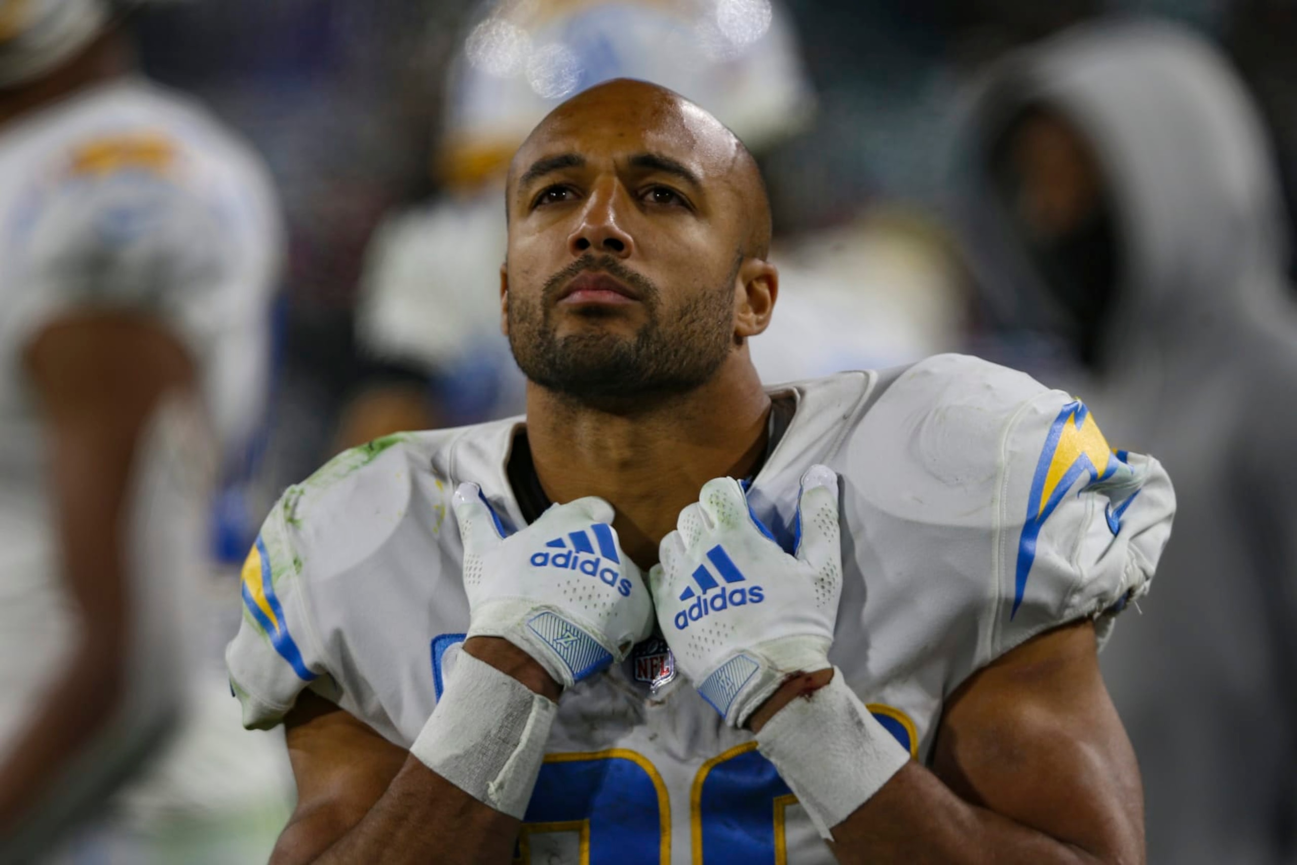 Los Angeles Chargers running back Austin Ekeler (30) looks up at a video screen during an NFL wild-card football game against the Jacksonville Jaguars, Saturday, Jan. 14, 2023, in Jacksonville, Fla. The Jaguars defeated the Chargers 31-30. (AP Photo/Gary McCullough)