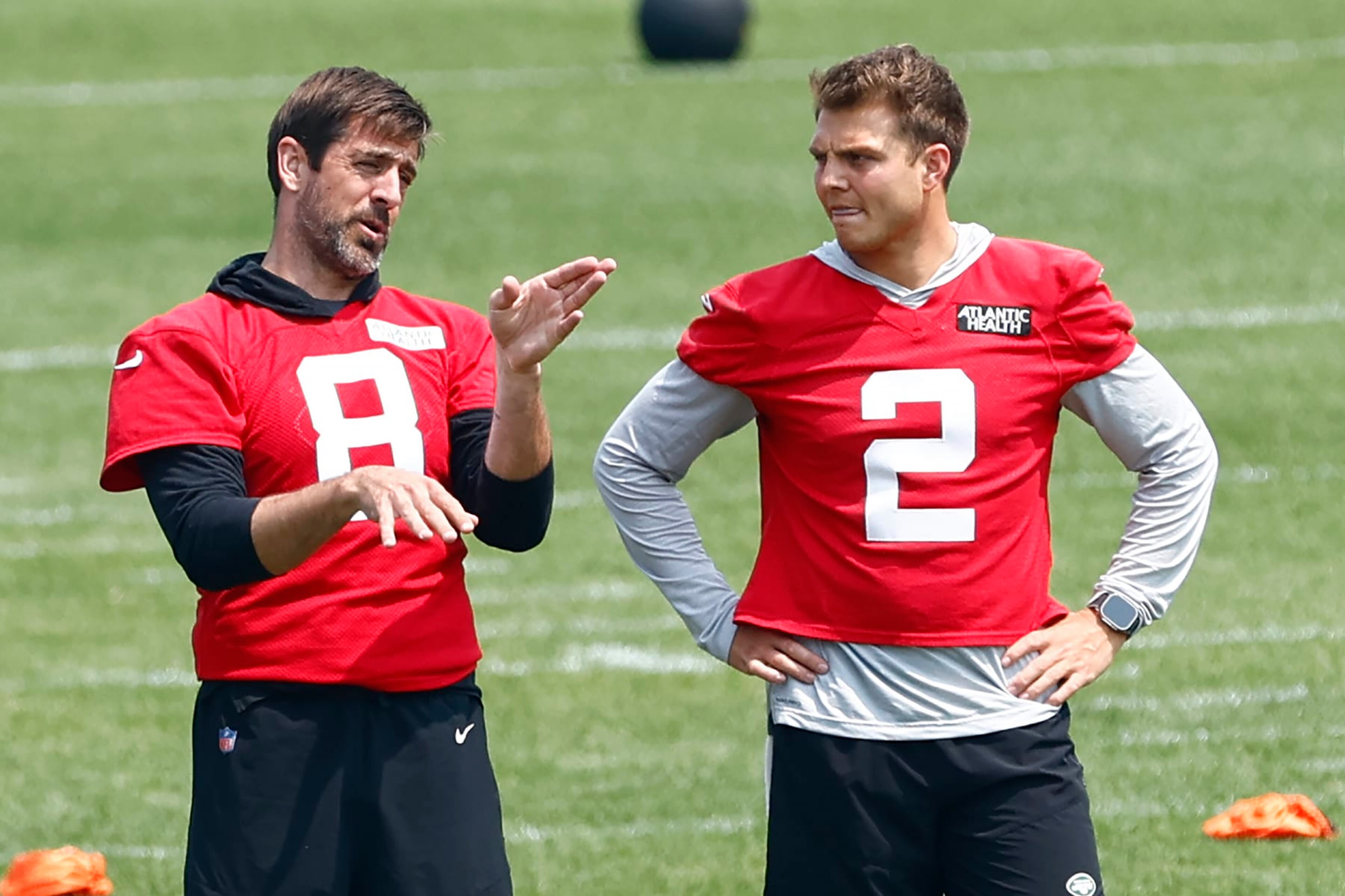 FLORHAM PARK, NEW JERSEY - JUNE 6: Quarterbacks Aaron Rodgers #8 and Zach Wilson #2 of the New York Jets talk during the teams OTAs at Atlantic Health Jets Training Center on June 6, 2023 in Florham Park, New Jersey. (Photo by Rich Schultz/Getty Images)