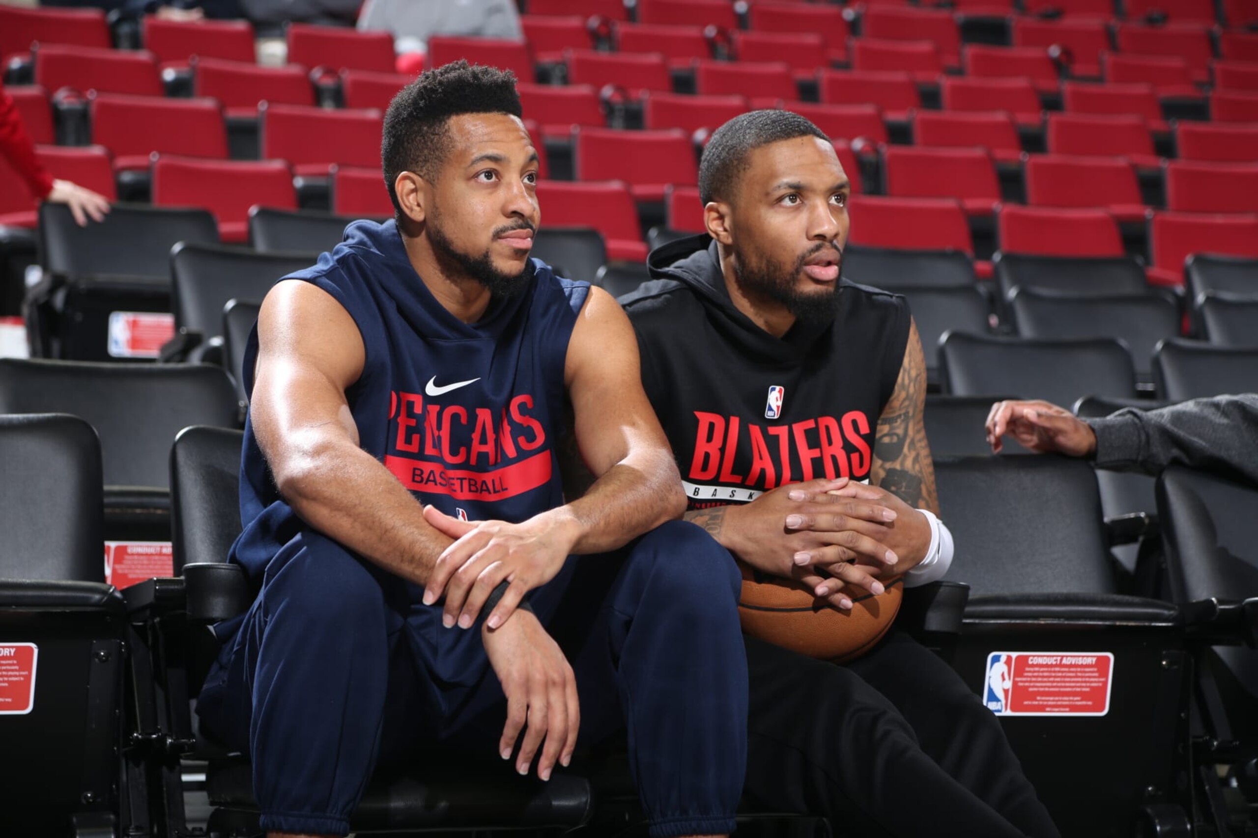 PORTLAND, OR - MARCH 27: CJ McCollum #3 of the New Orleans Pelicans talks with Damian Lillard #0 of the Portland Trail Blazers before the game on March 27, 2023 at the Moda Center Arena in Portland, Oregon. NOTE TO USER: User expressly acknowledges and agrees that, by downloading and or using this photograph, user is consenting to the terms and conditions of the Getty Images License Agreement. Mandatory Copyright Notice: Copyright 2023 NBAE (Photo by Sam Forencich/NBAE via Getty Images)