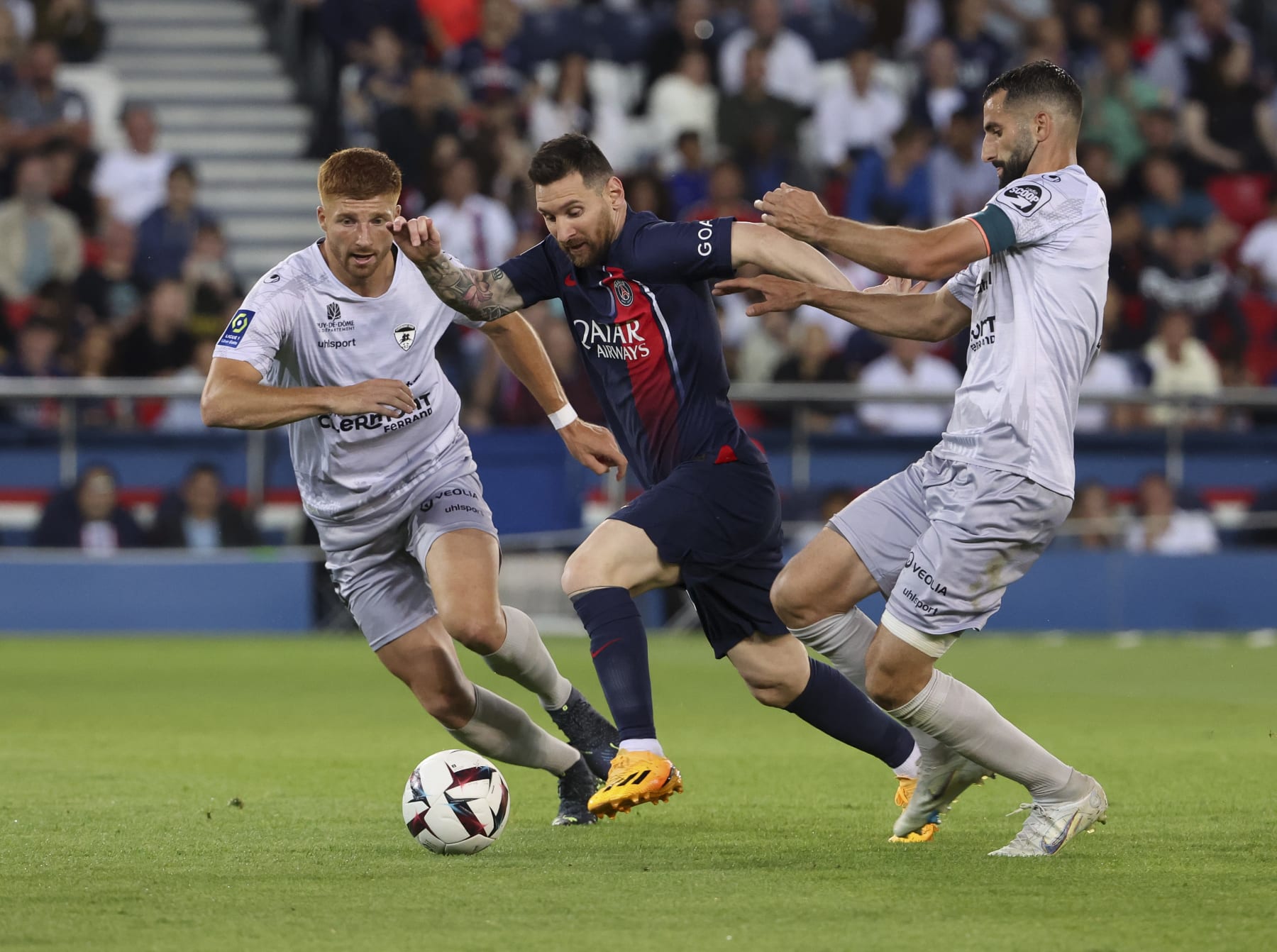 PARIS, FRANCE - JUNE 3: Lionel Messi of PSG in action between Maximiliano Caufriez and Maxime Gonalons of Clermont during the Ligue 1 match between Paris Saint-Germain (PSG) and Clermont Foot 63 at Parc des Princes stadium on June 3, 2023 in Paris, France. (Photo by Jean Catuffe/Getty Images)