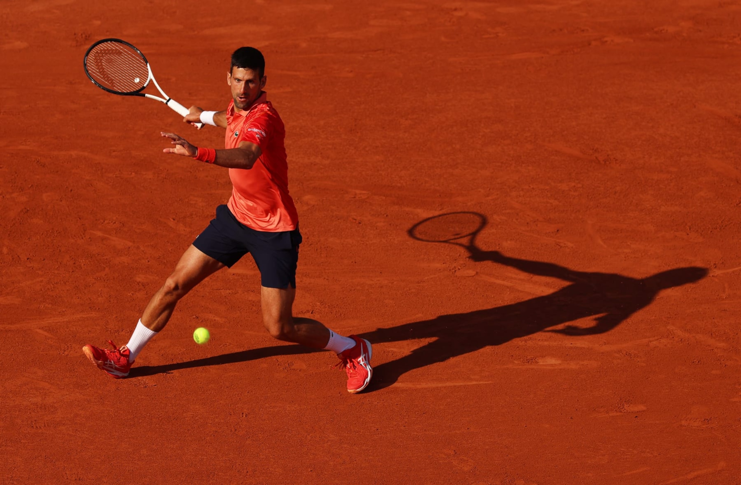 PARIS, FRANCE - JUNE 06: Novak Djokovic of Serbia plays a forehand against Karen Khachanov during the Men's Singles Quarter Final match on Day Ten of the 2023 French Open at Roland Garros on June 06, 2023 in Paris, France.  (Photo by Clive Brunskill/Getty Images)