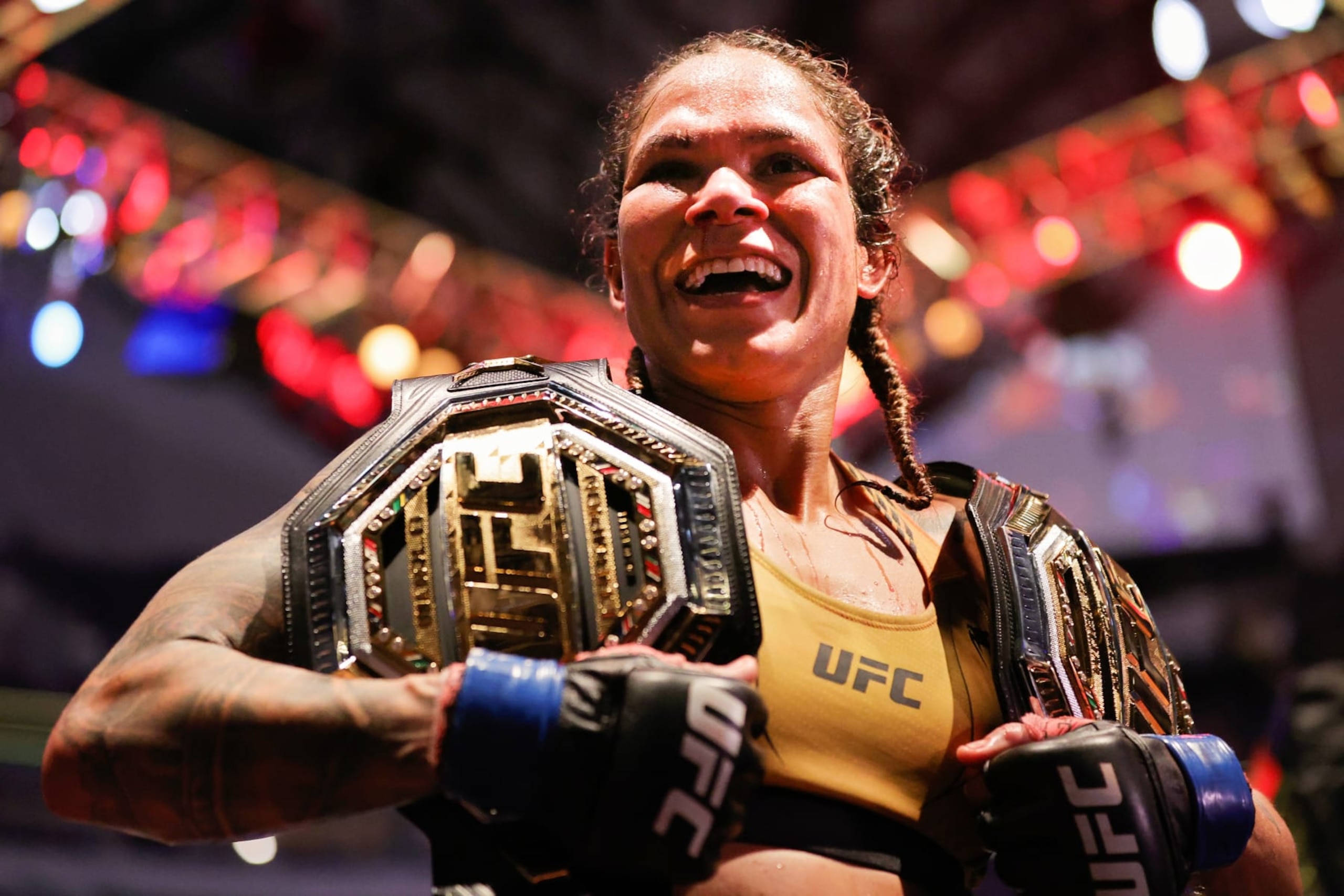 DALLAS, TEXAS - JULY 30: Amanda Nunes of Brazil celebrates after defeating Julianna Pena in their bantamweight title bout during UFC 277 at American Airlines Center on July 30, 2022 in Dallas, Texas. Amanda Nunes won via unanimous decision. (Photo by Carmen Mandato/Getty Images)