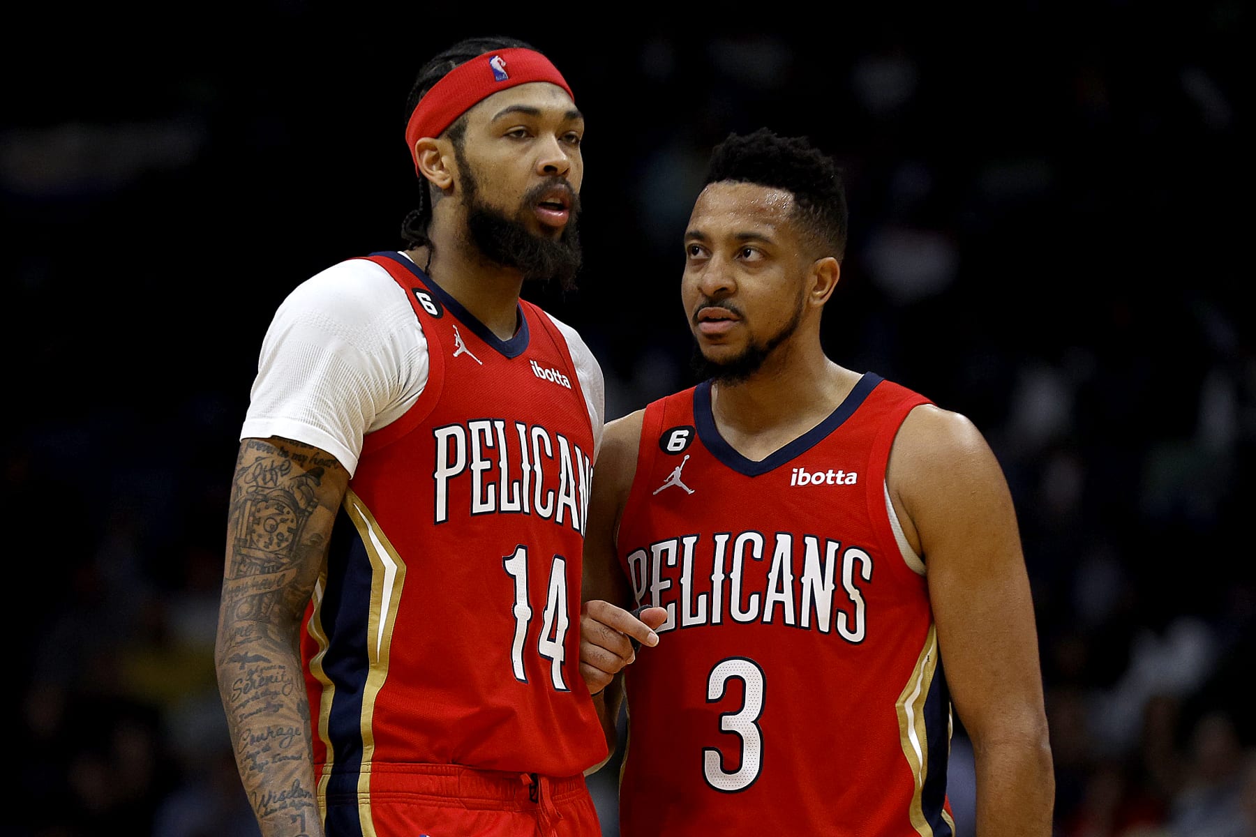 NEW ORLEANS, LOUISIANA - MARCH 14: Brandon Ingram #14 of the New Orleans Pelicans and CJ McCollum #3 of the New Orleans Pelicans stand on the court during the fourth quarter of an NBA game against the Los Angeles Lakers at Smoothie King Center on March 14, 2023 in New Orleans, Louisiana.  NOTE TO USER: User expressly acknowledges and agrees that, by downloading and or using this photograph, User is consenting to the terms and conditions of the Getty Images License Agreement. (Photo by Sean Gardner/Getty Images)