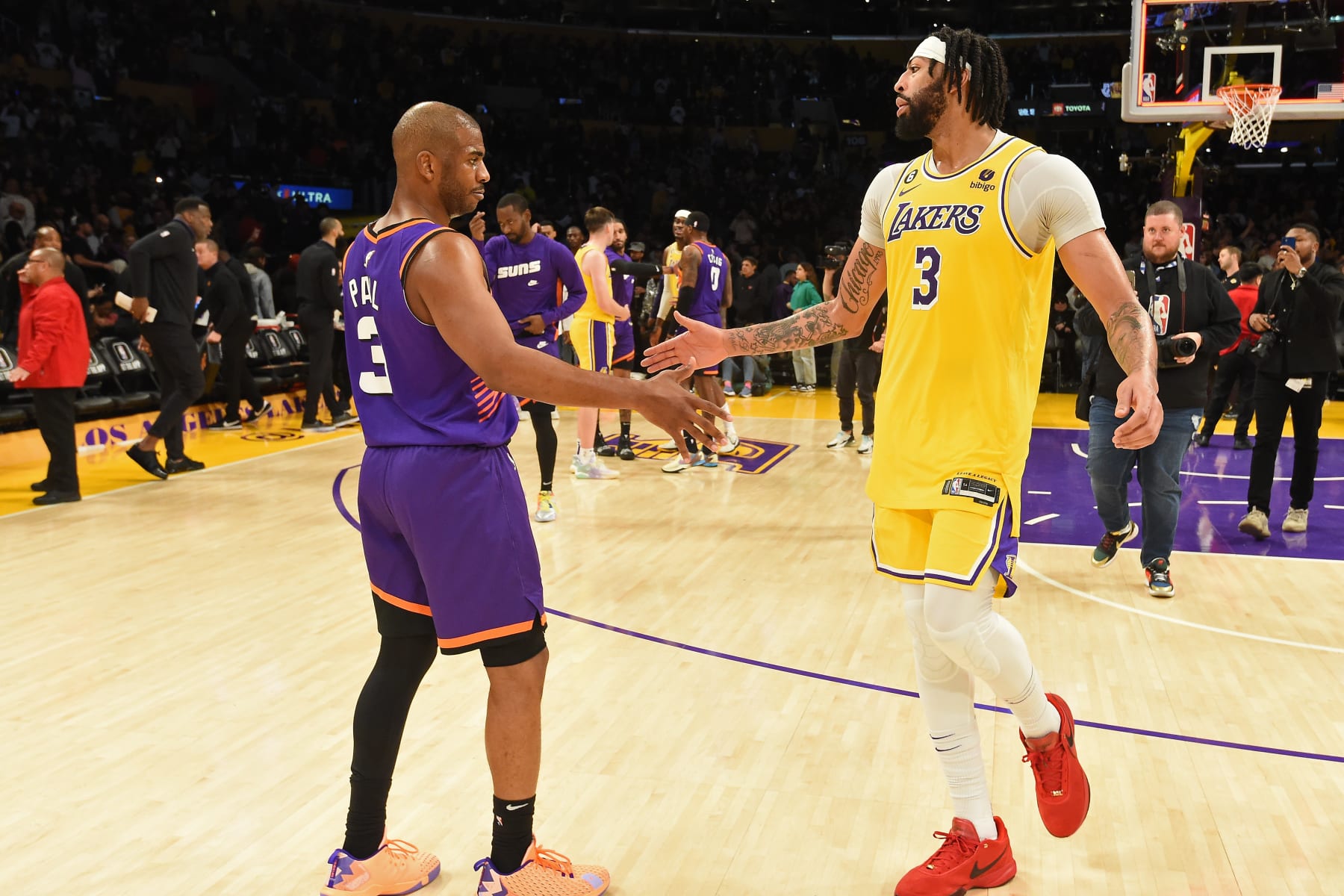 LOS ANGELES, CA - MARCH 23: Chris Paul #3 of the Phoenix Suns and Anthony Davis #3 of the Los Angeles Lakers high fives after the game on March 23, 2023 at Crypto.Com Arena in Los Angeles, California. NOTE TO USER: User expressly acknowledges and agrees that, by downloading and/or using this Photograph, user is consenting to the terms and conditions of the Getty Images License Agreement. Mandatory Copyright Notice: Copyright 2023 NBAE (Photo by Juan Ocampo/NBAE via Getty Images)