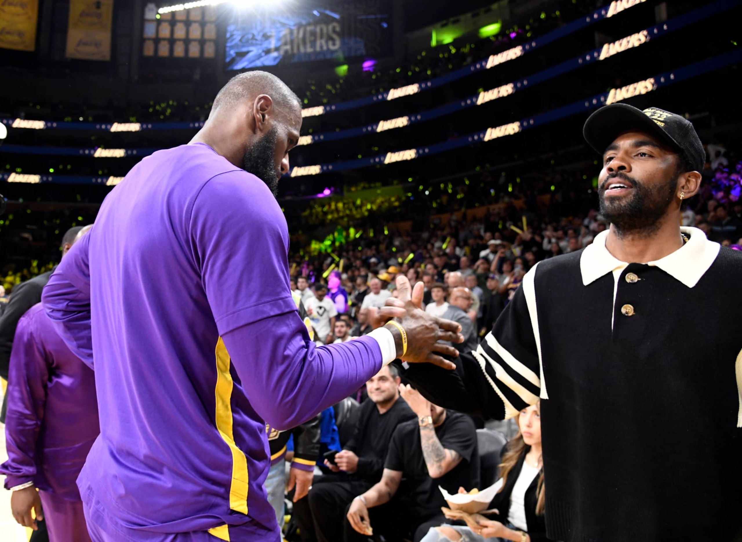 LOS ANGELES, CA - APRIL 28: Kyrie Irving #2 of the Dallas Mavericks greets LeBron James #6 of the Los Angeles Lakers as he attends a basketball game between Los Angeles Lakers and Memphis Grizzlies Round 1 Game 6 of the 2023 NBA Playoffs against Los Angeles Lakers at Crypto.com Arena on April 28, 2023 in Los Angeles, California. (Photo by Kevork Djansezian/Getty Images)