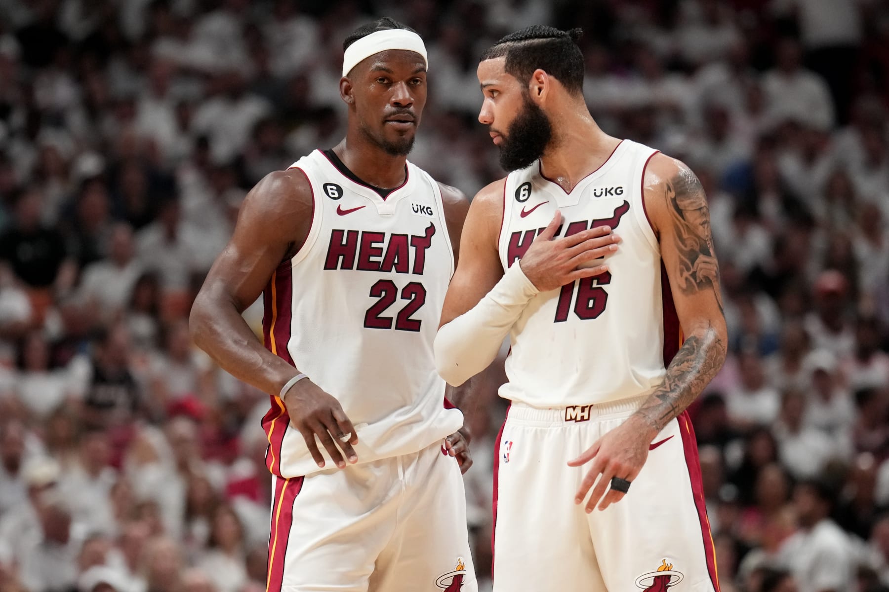 MIAMI, FL - JUNE 7: Jimmy Butler #22 talks with Caleb Martin #16 of the Miami Heat during Game Three of the 2023 NBA Finals on June 7, 2023 at Kaseya Center in Miami, Florida. NOTE TO USER: User expressly acknowledges and agrees that, by downloading and or using this Photograph, user is consenting to the terms and conditions of the Getty Images License Agreement. Mandatory Copyright Notice: Copyright 2023 NBAE (Photo by Jesse D. Garrabrant/NBAE via Getty Images)