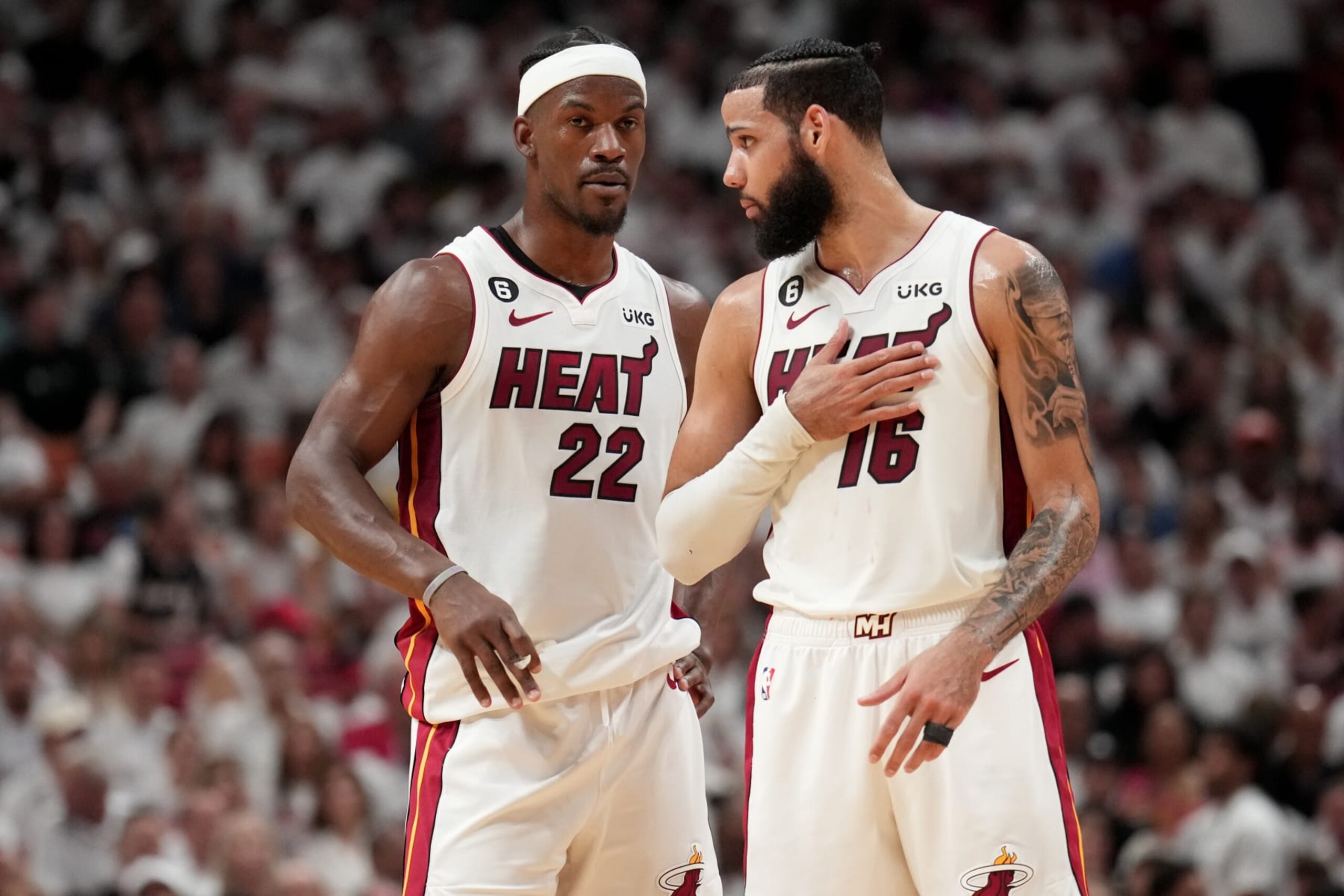 MIAMI, FL - JUNE 7: Jimmy Butler #22 talks with Caleb Martin #16 of the Miami Heat during Game Three of the 2023 NBA Finals on June 7, 2023 at Kaseya Center in Miami, Florida. NOTE TO USER: User expressly acknowledges and agrees that, by downloading and or using this Photograph, user is consenting to the terms and conditions of the Getty Images License Agreement. Mandatory Copyright Notice: Copyright 2023 NBAE (Photo by Jesse D. Garrabrant/NBAE via Getty Images)