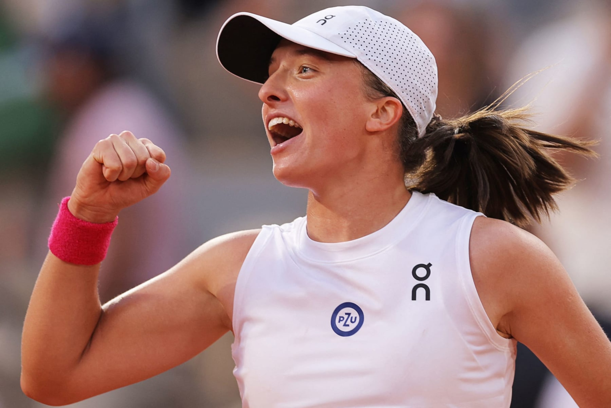 Poland's Iga Swiatek celebrates after winning against Brazil's Beatriz Haddad Maia at the end of their women's singles semi-final match on day twelve of the Roland-Garros Open tennis tournament at the Court Philippe-Chatrier in Paris on June 8, 2023. (Photo by Thomas SAMSON / AFP) (Photo by THOMAS SAMSON/AFP via Getty Images)