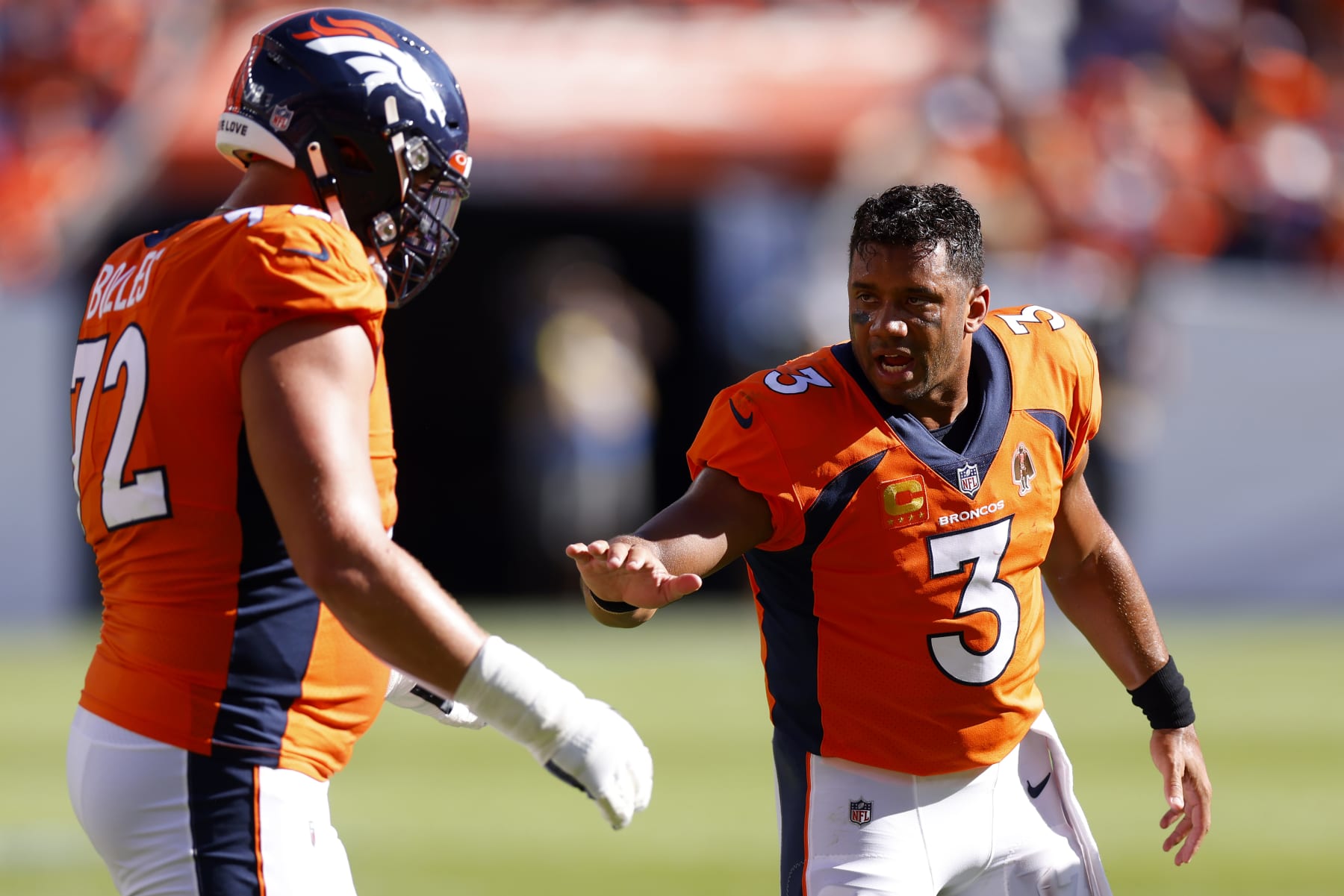 DENVER, COLORADO - SEPTEMBER 18: Russell Wilson #3 of the Denver Broncos congratulates Garett Bolles #72 of the Denver Broncos after a successful field goal in the second quarter of the game against the Houston Texans at Empower Field At Mile High on September 18, 2022 in Denver, Colorado. (Photo by Justin Edmonds/Getty Images)
